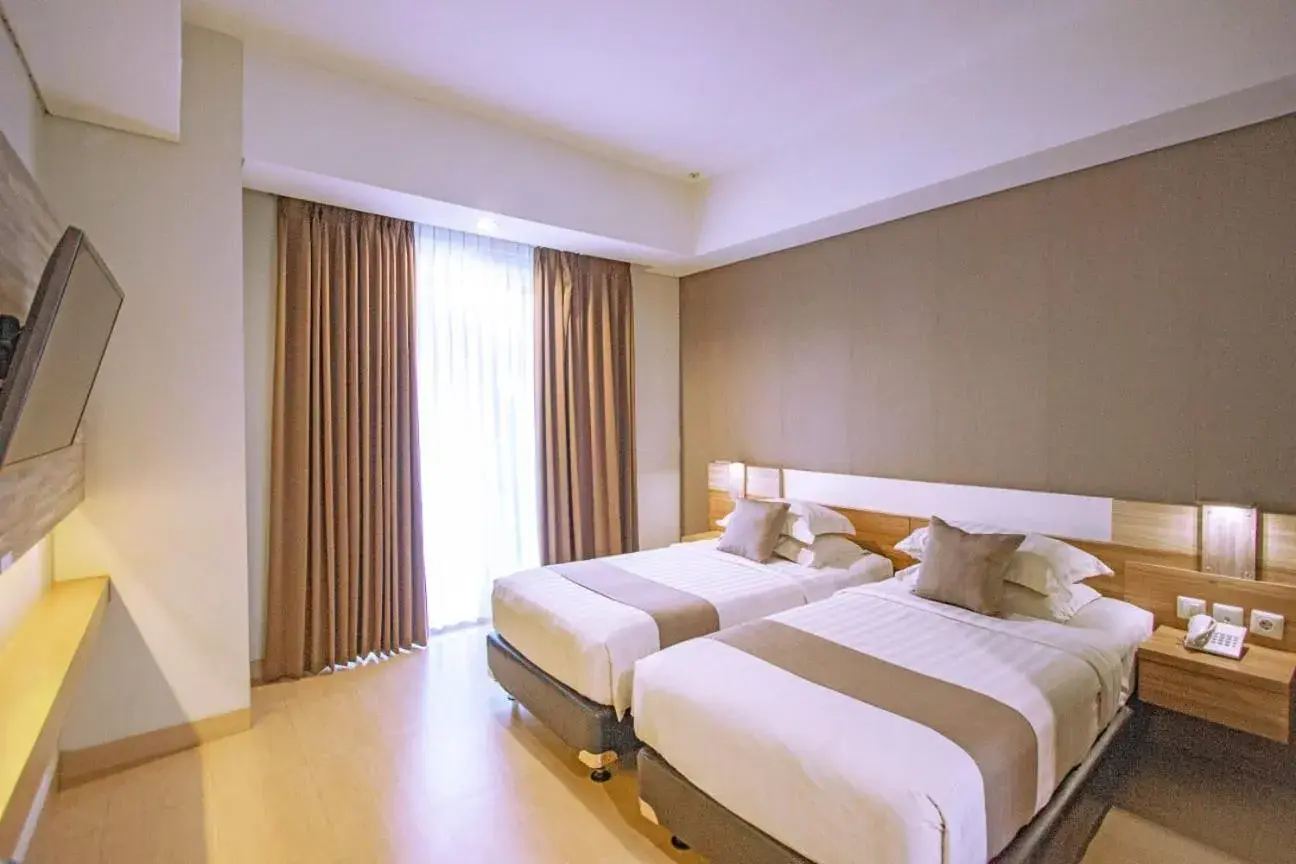 Bed in Hotel Dafam Fortuna Seturan
