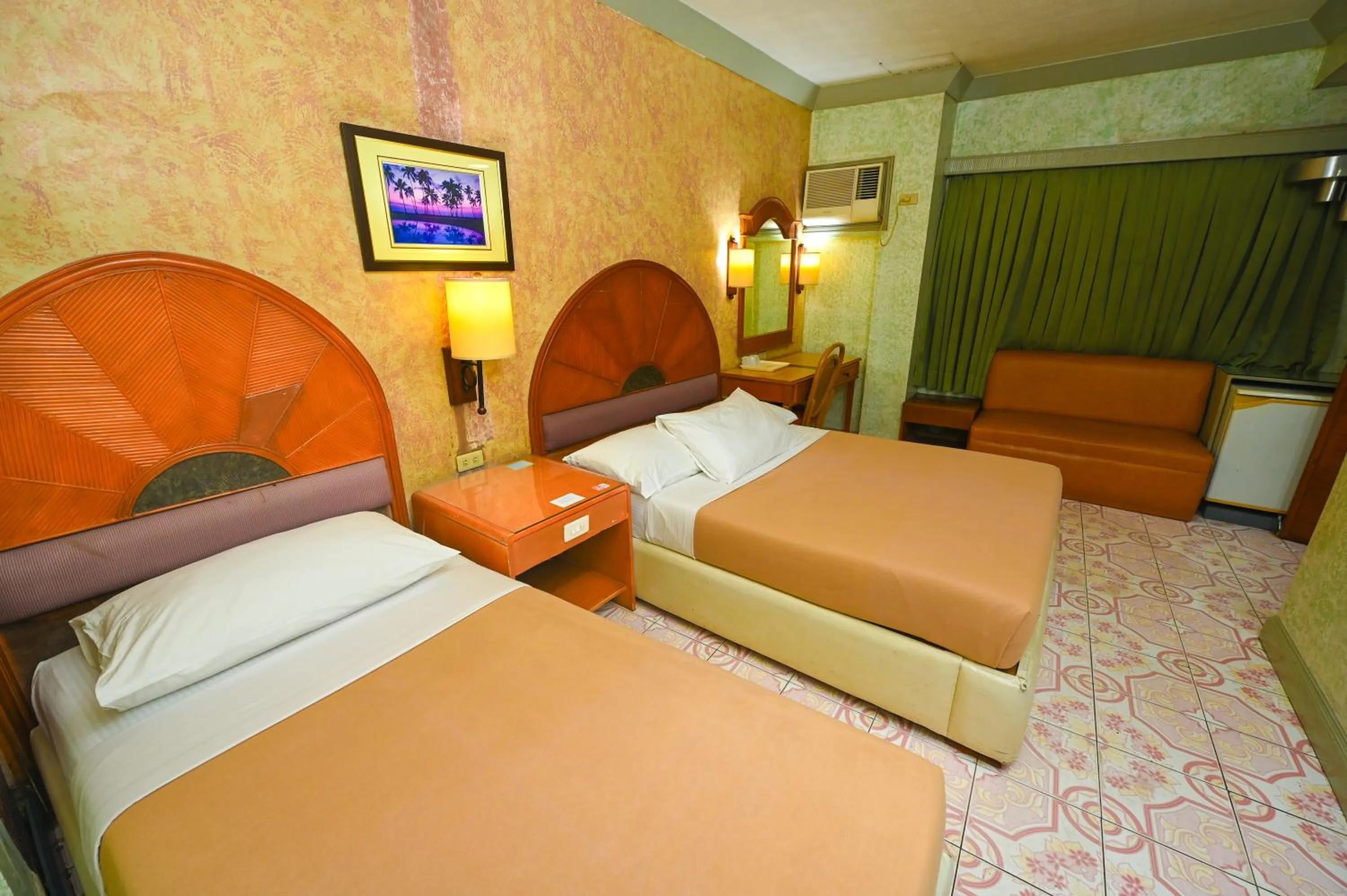 Bed in Grand City Hotel Inc.