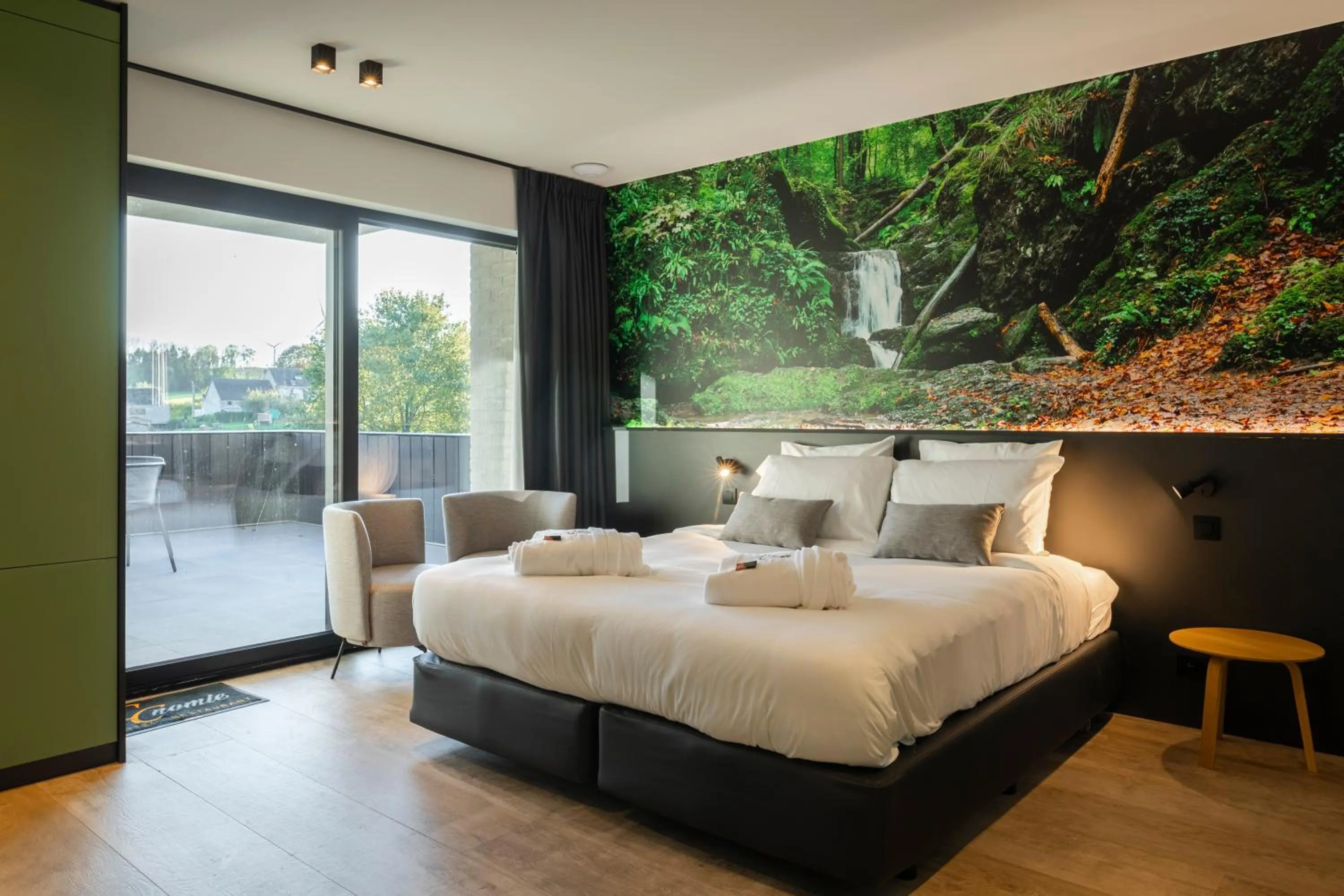 Bed in CC Nomie Hôtel Restaurant