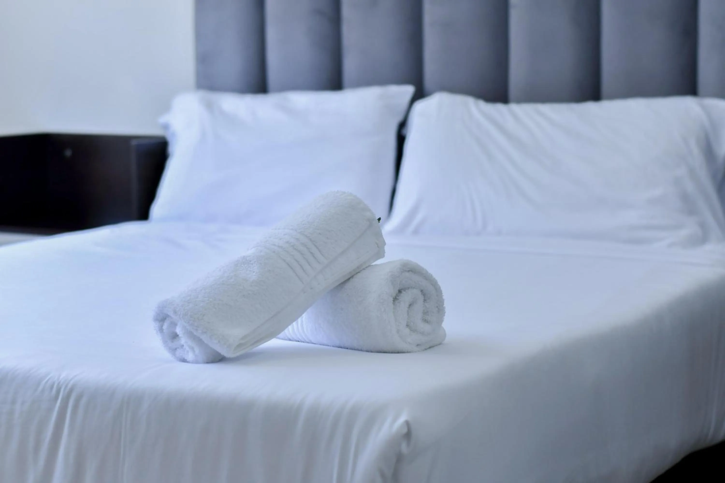 Bed in Bayside Hotel Suites