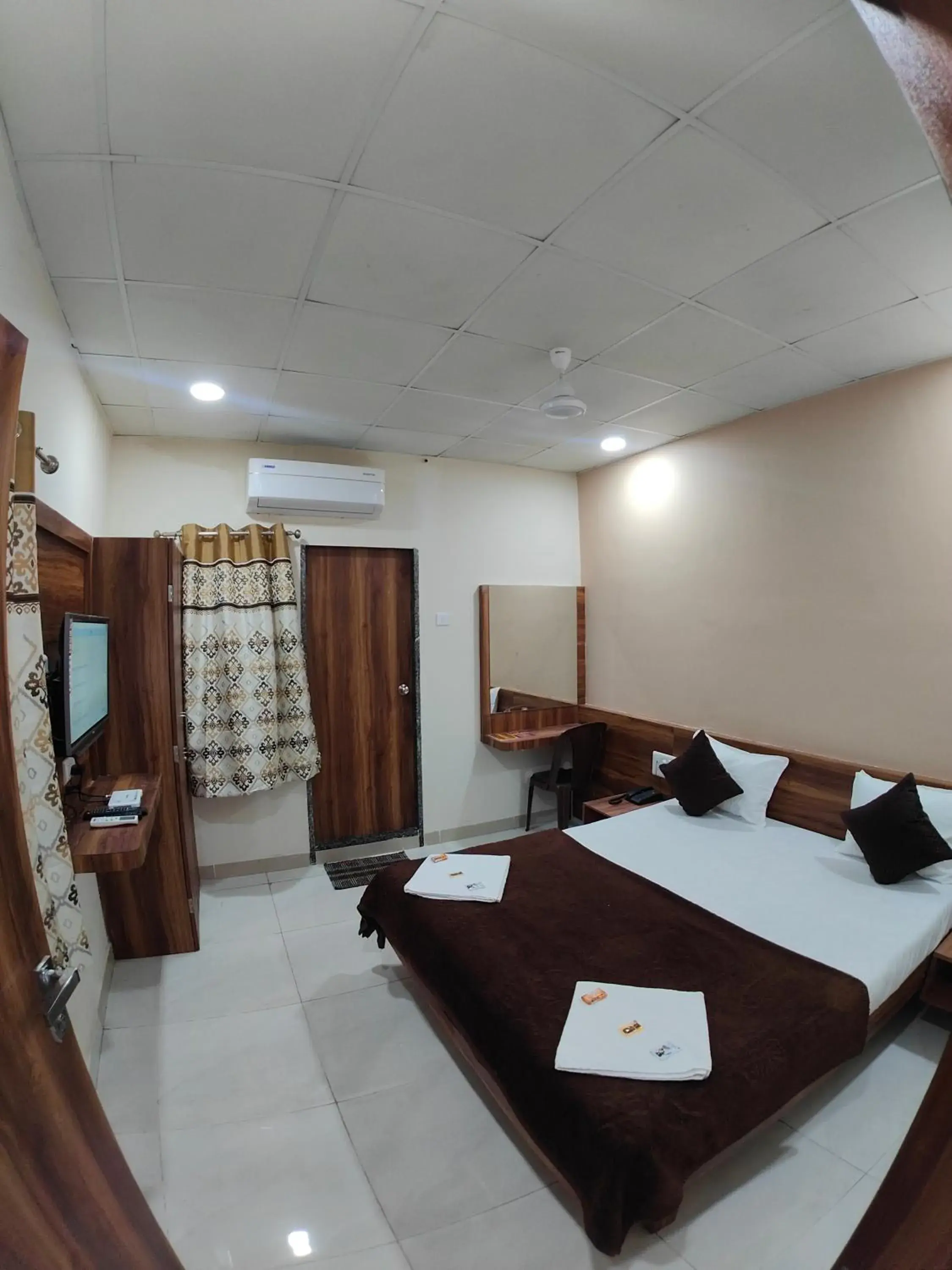 TV and multimedia, Bed in Hotel Samruddhi Residency TV and multimedia, Bed in Hotel Samruddhi Residency