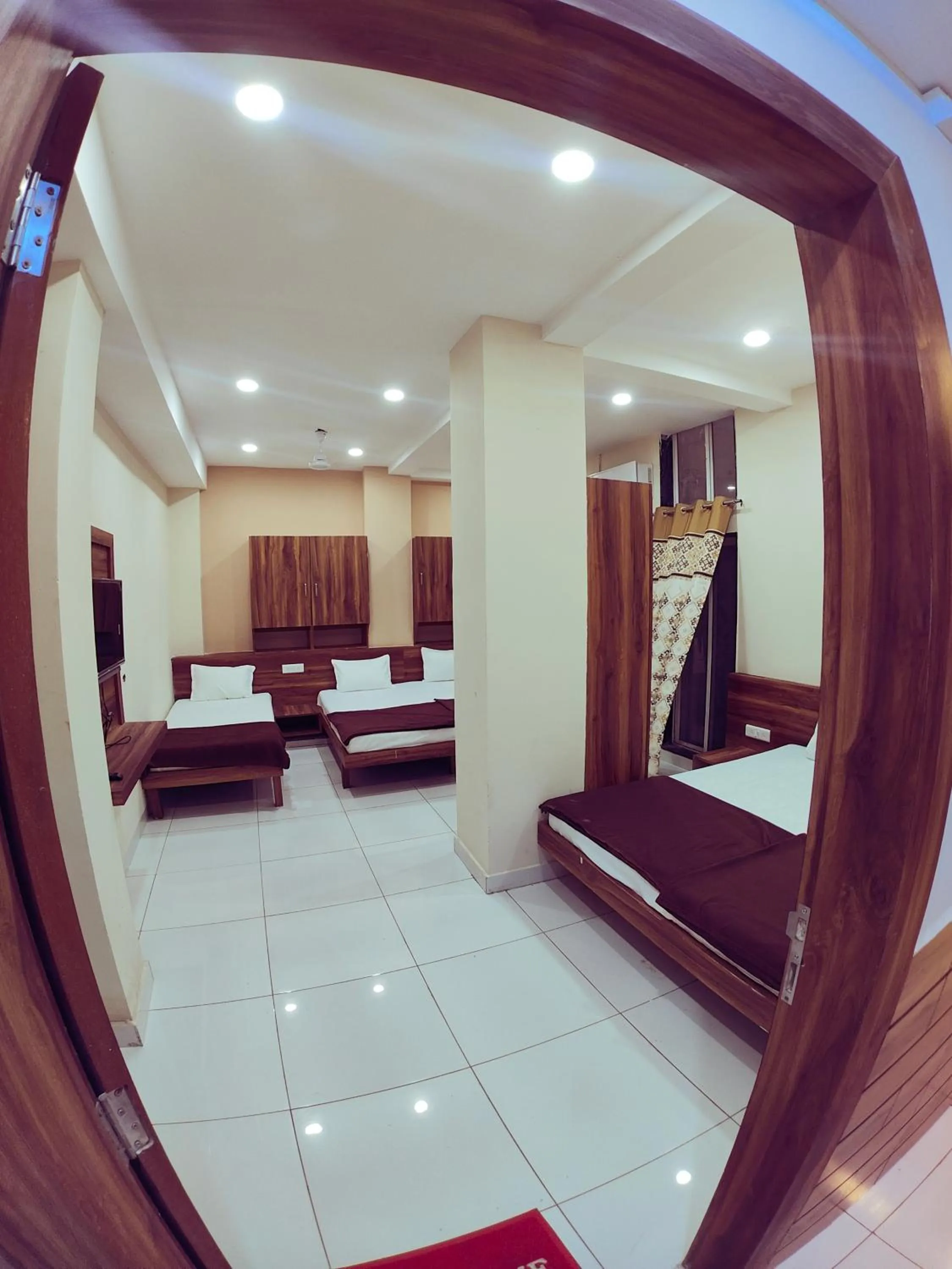 Bed in Hotel Samruddhi Residency