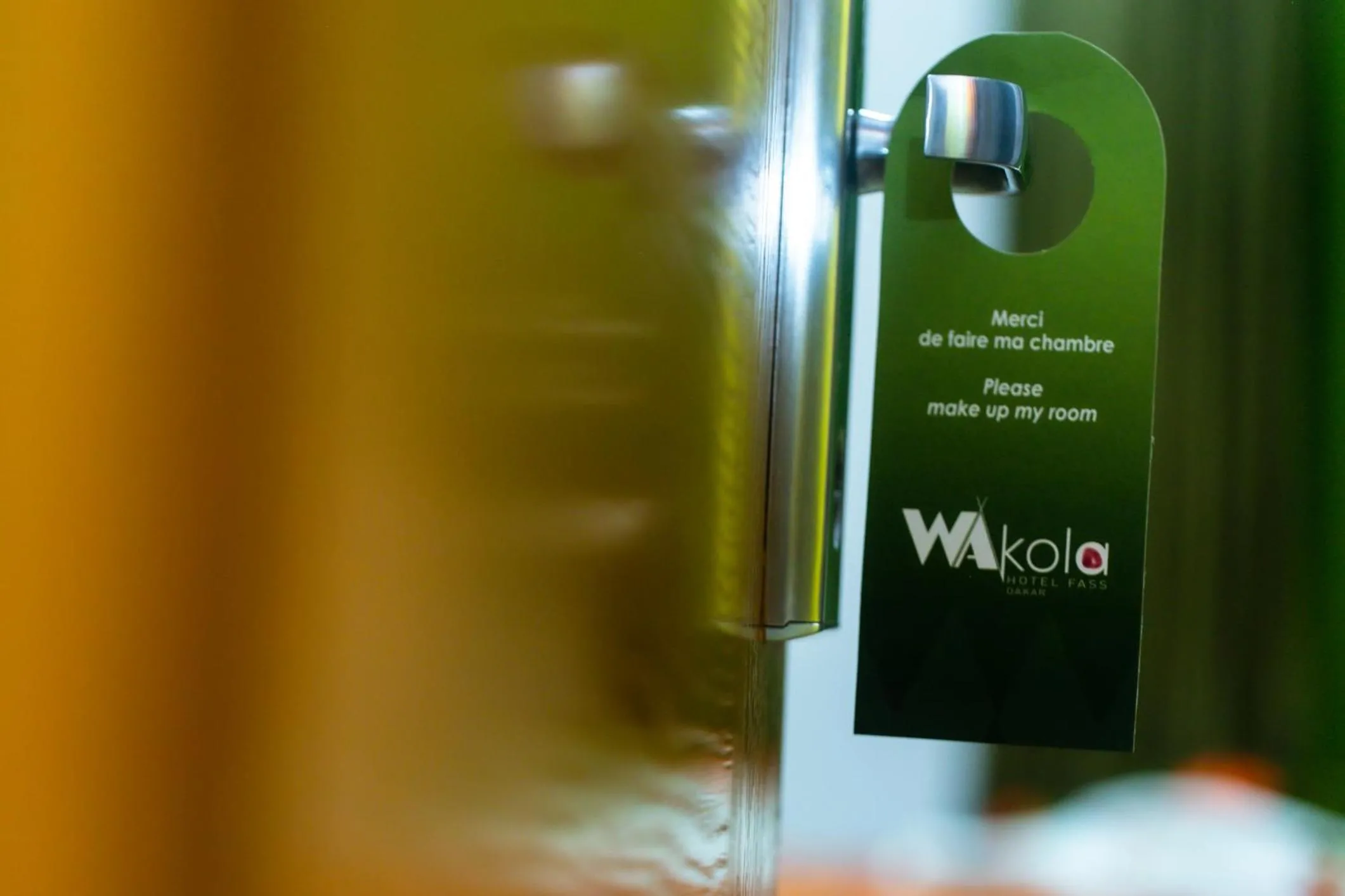 Text overlay in Wakola Hotel Cheikh Anta DIOP