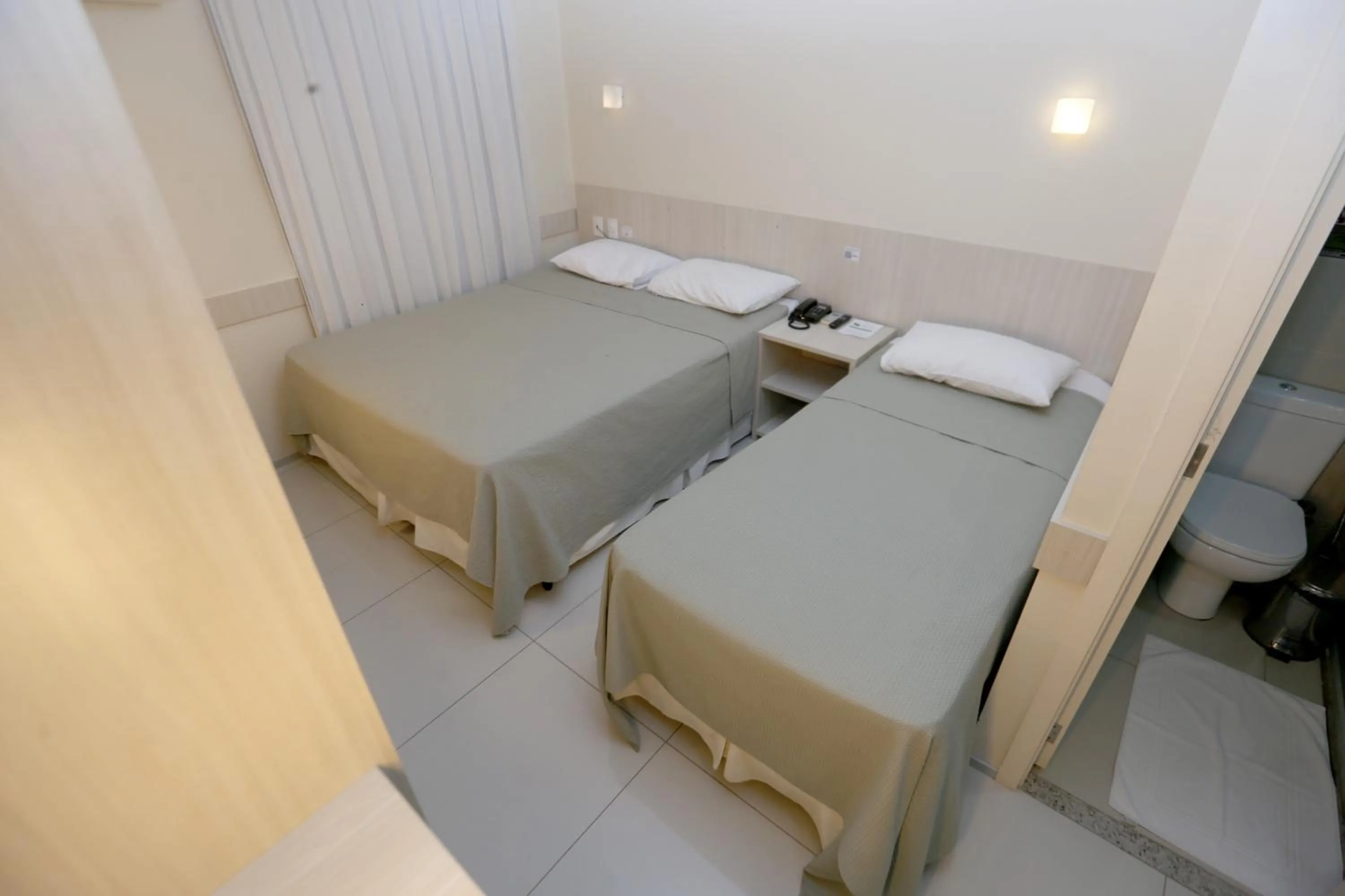 Bed in Stay Inn Hotel