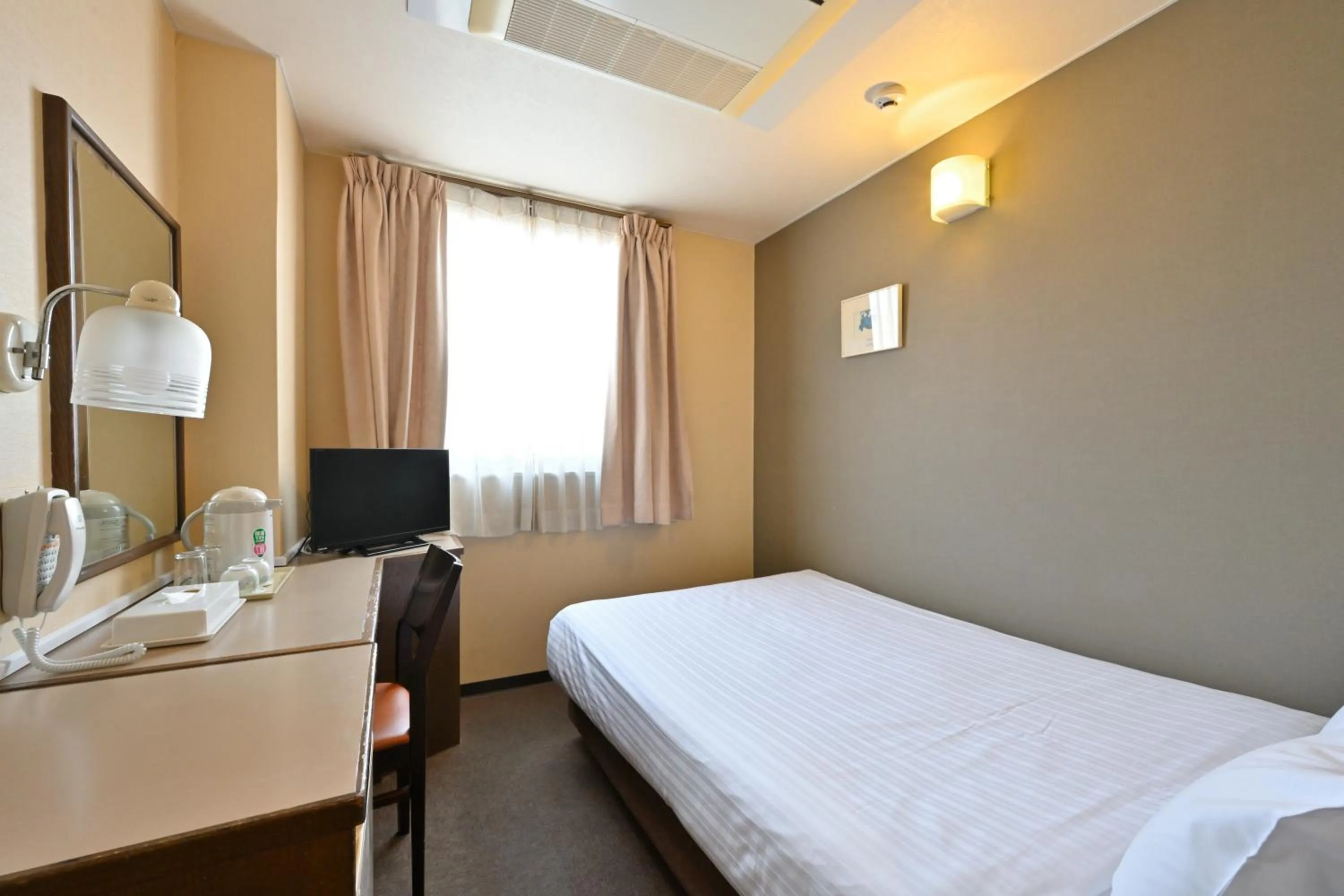 Bed in Wakayama Daini Fuji Hotel