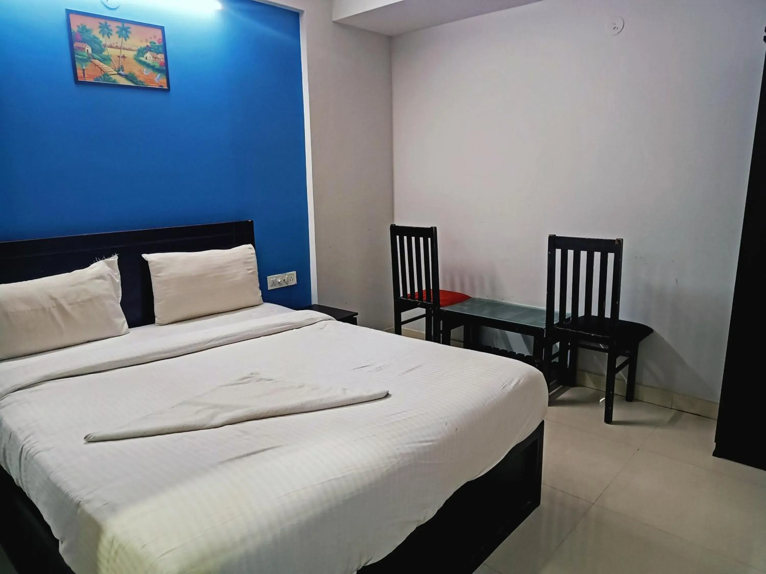 Bedroom in Delta Inn Madiwala Bedroom in Delta Inn Madiwala