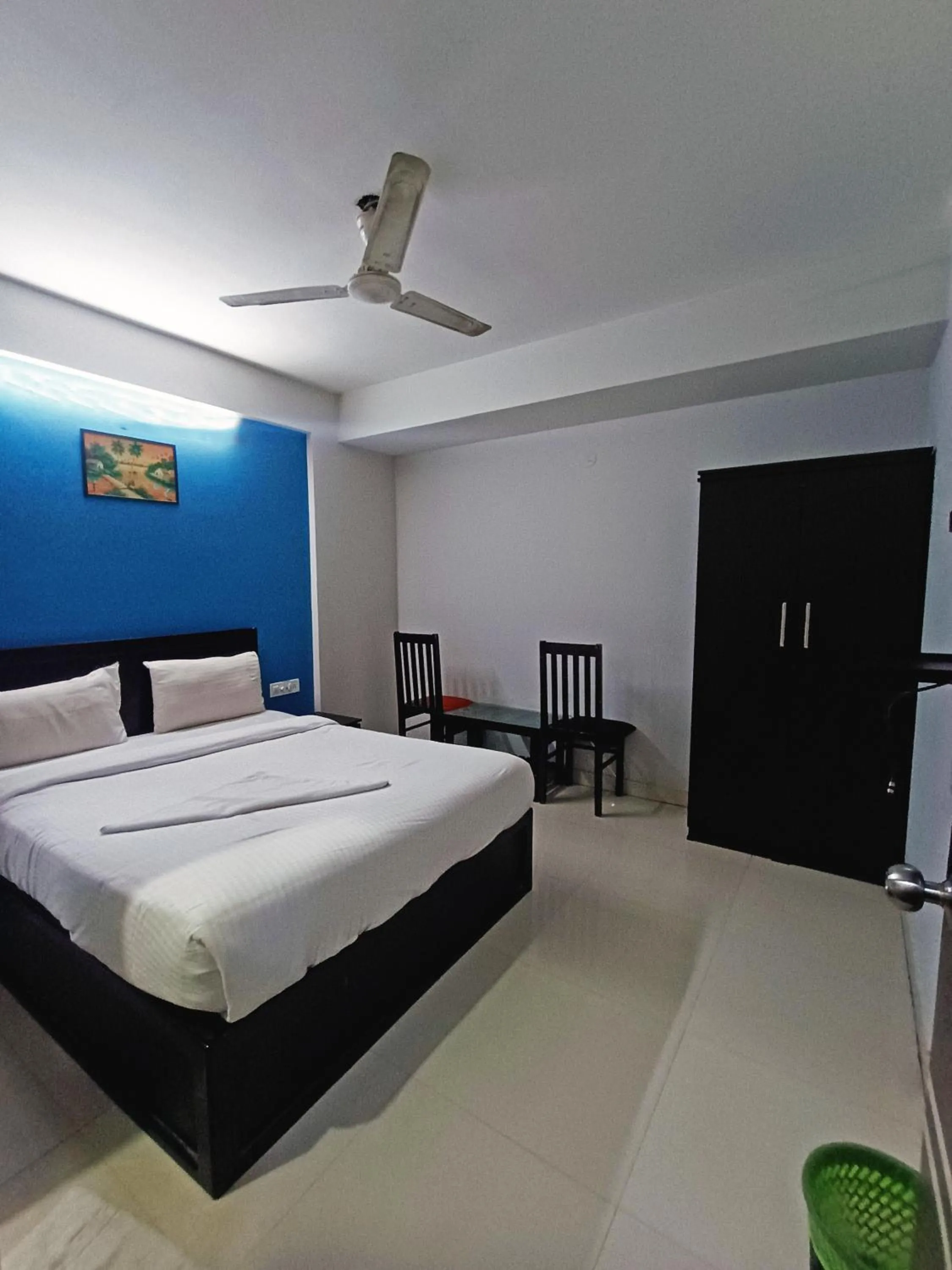 Bedroom in Delta Inn Madiwala