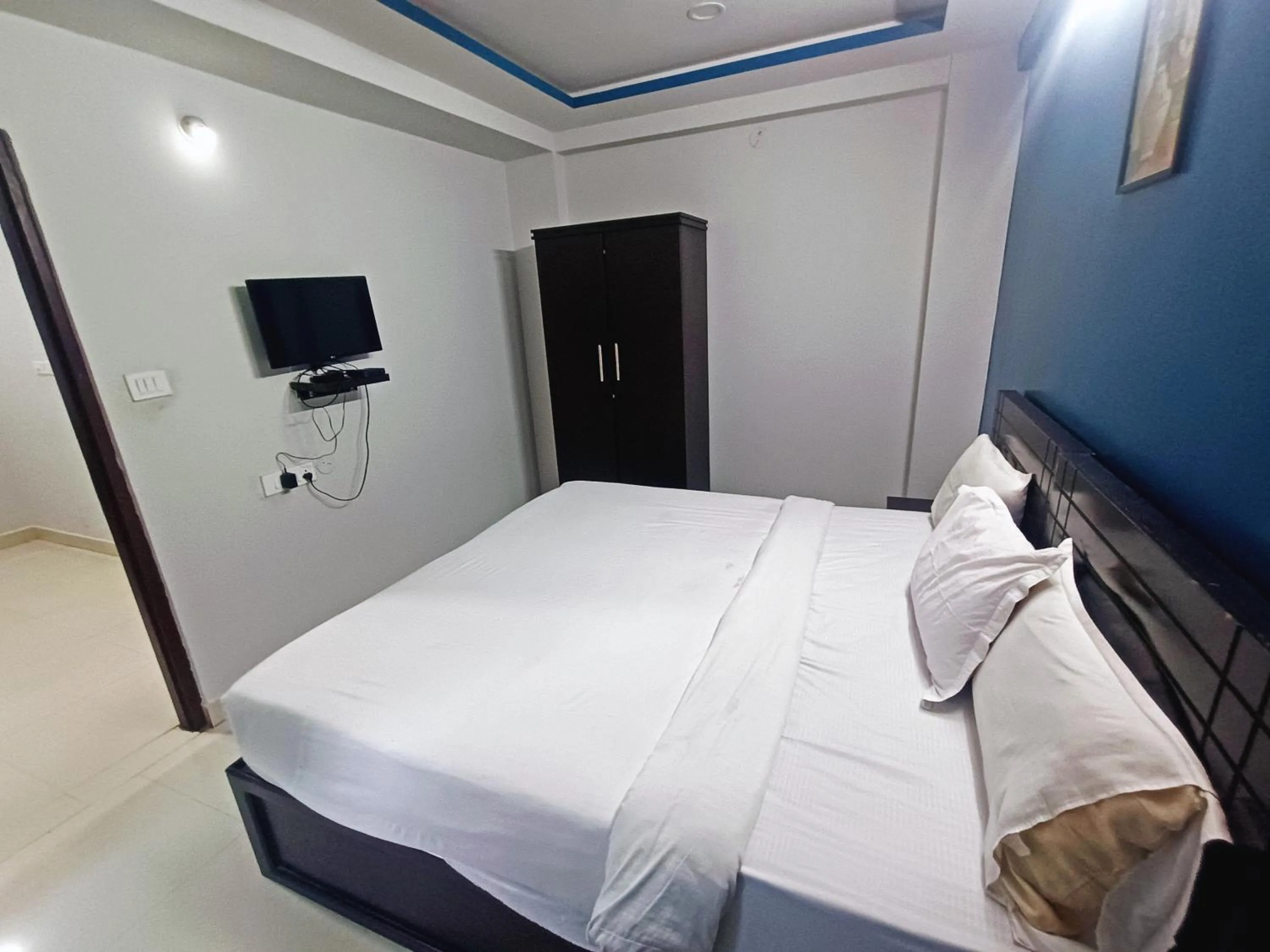 Bedroom in Delta Inn Madiwala