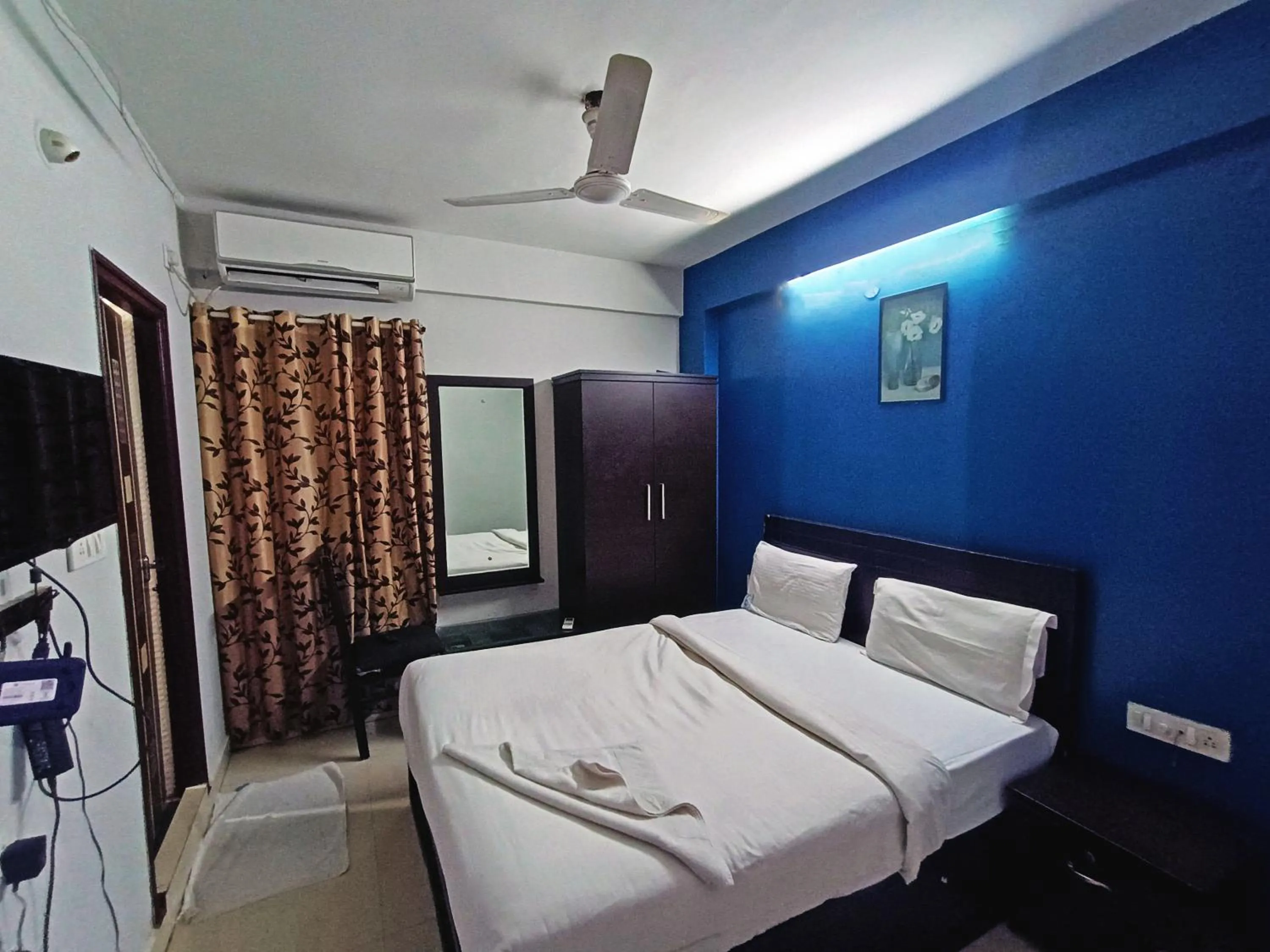 Bedroom in Delta Inn Madiwala