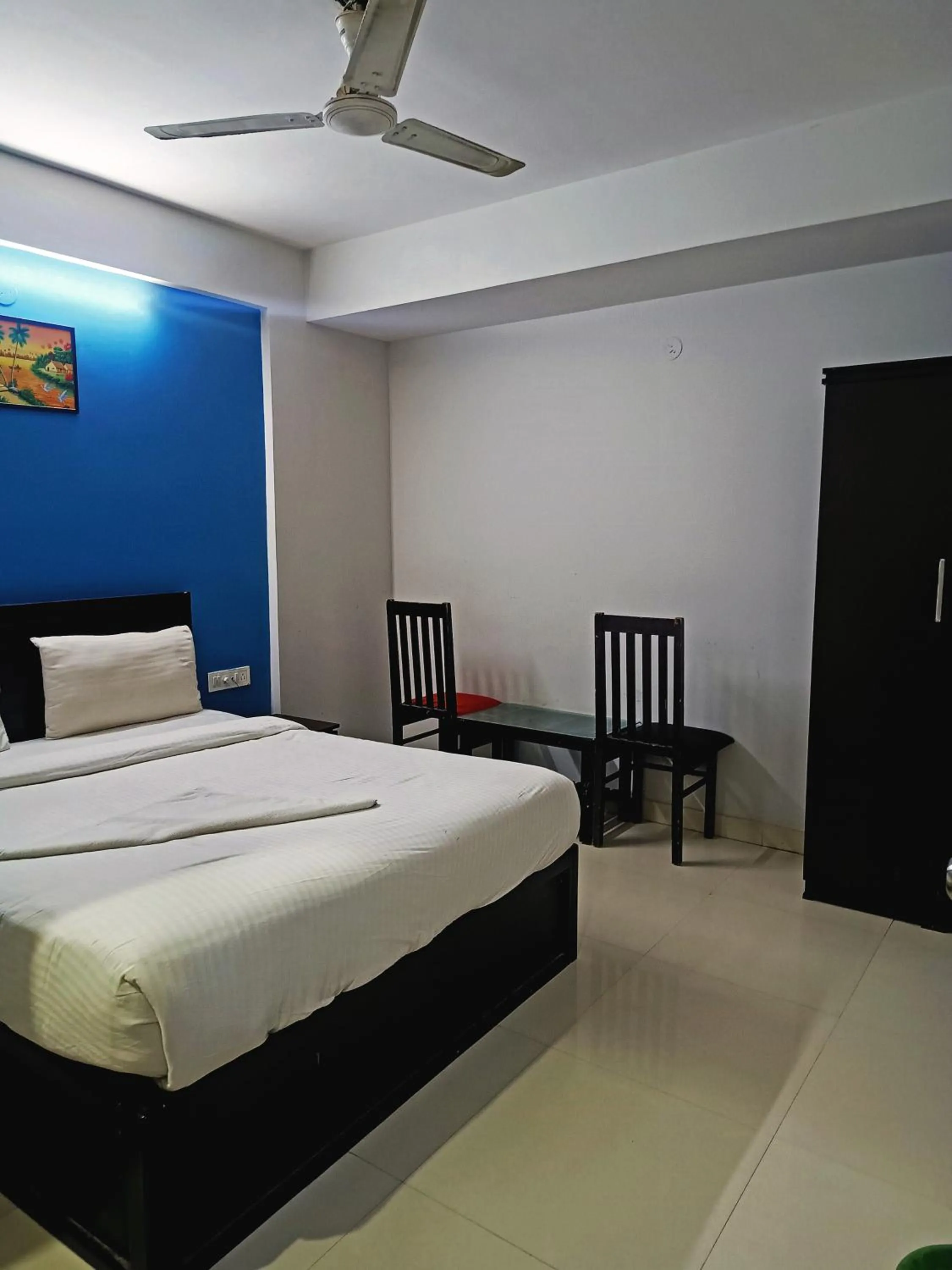 Bedroom in Delta Inn Madiwala