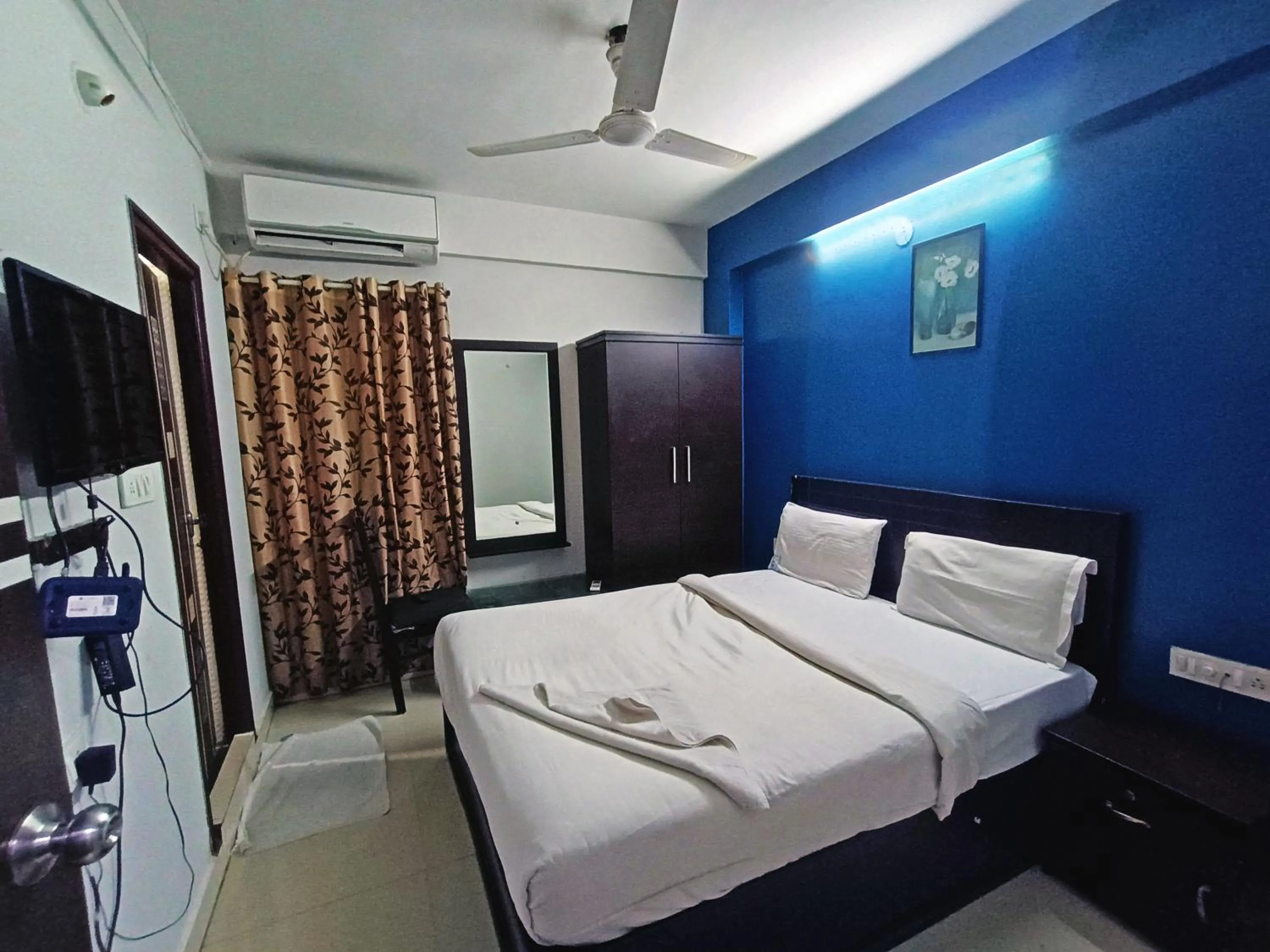 Bedroom in Delta Inn Madiwala