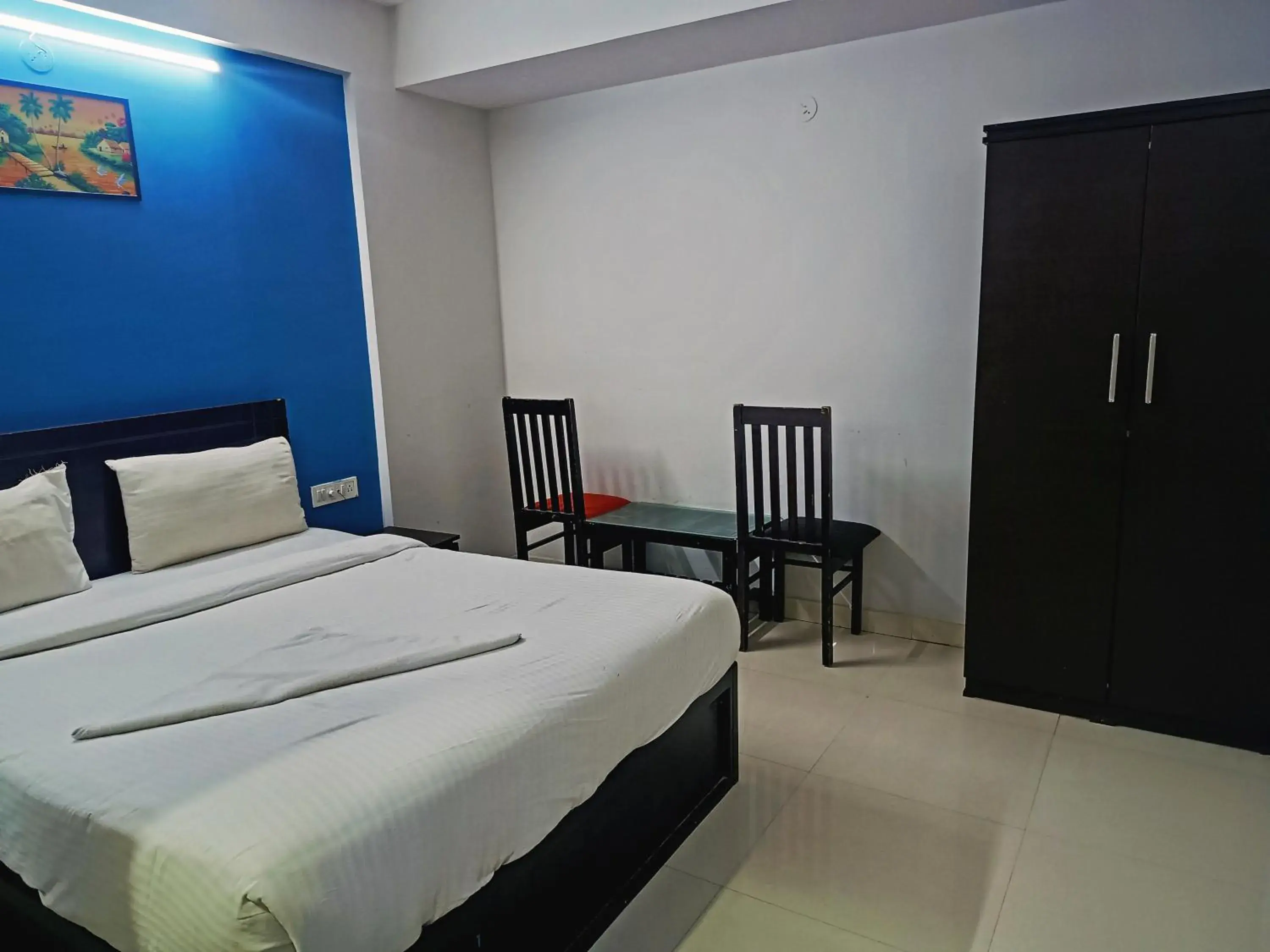 Bedroom in Delta Inn Madiwala Bedroom in Delta Inn Madiwala