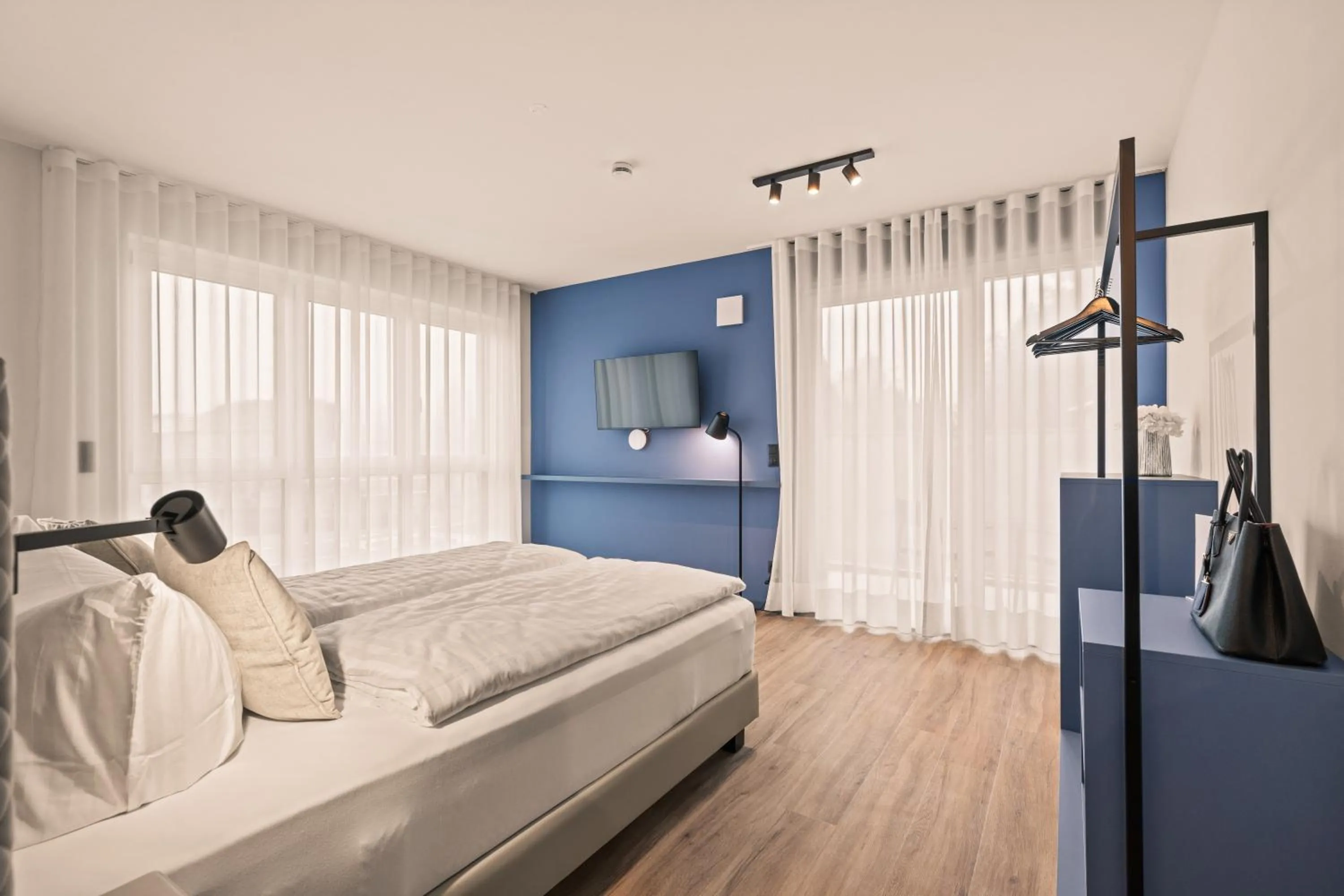 Bed in Motel42-Temporary Living
