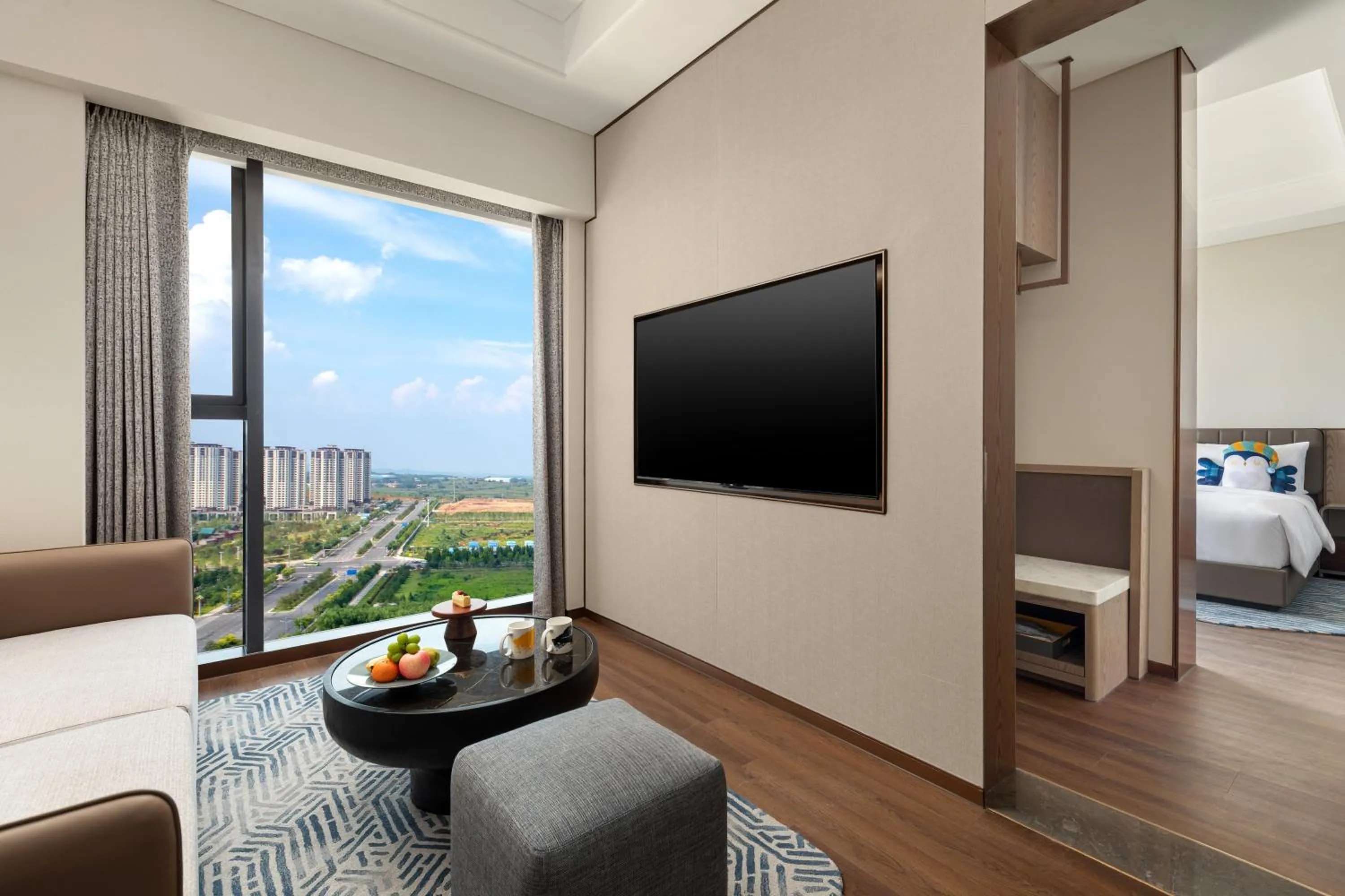 Communal lounge/ TV room, Bed in voco Jincheng Danhe by IHG