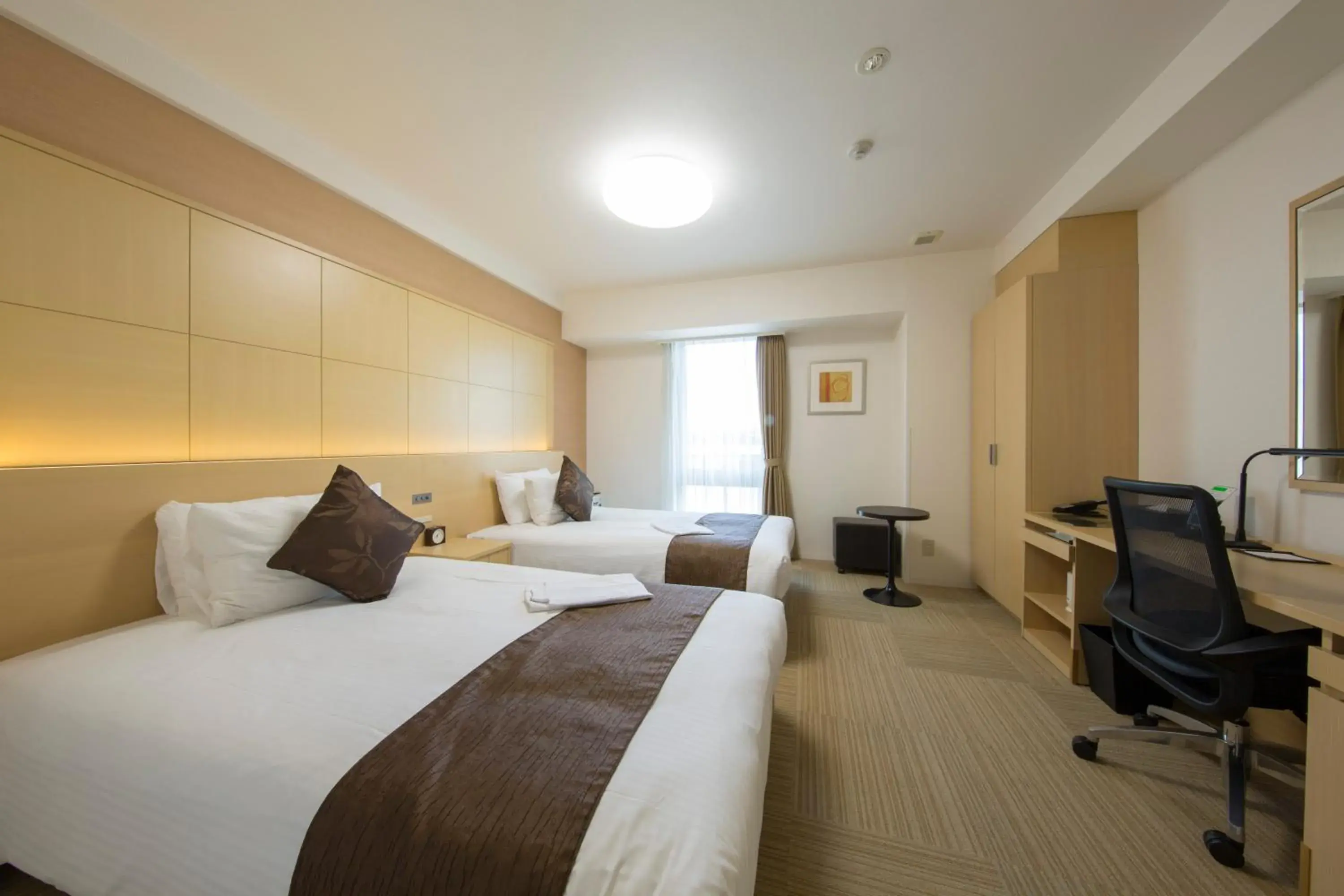 Bed in Shizutetsu Hotel Prezio Shizuoka Ekinan Bed in Shizutetsu Hotel Prezio Shizuoka Ekinan