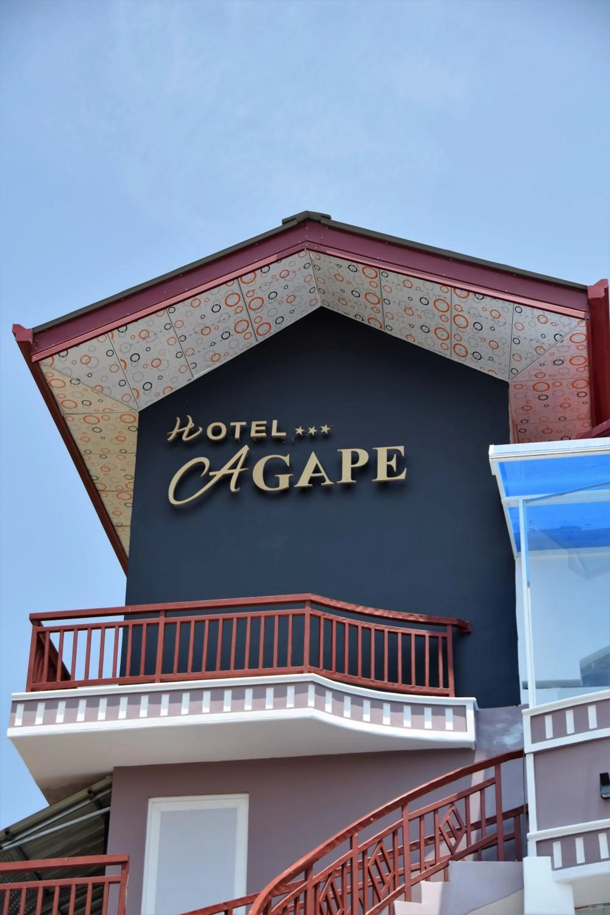 Property logo or sign in Hotel Agape