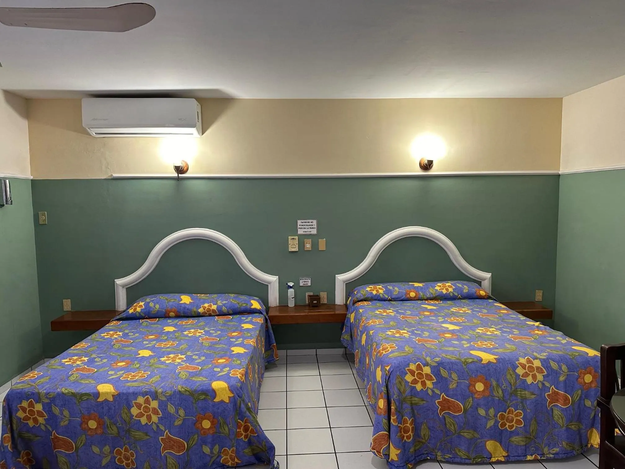 Bed in Blue Pacific Suites