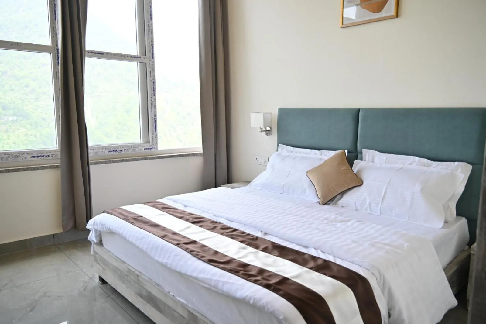 Bed in Prashanti Farms & Resort