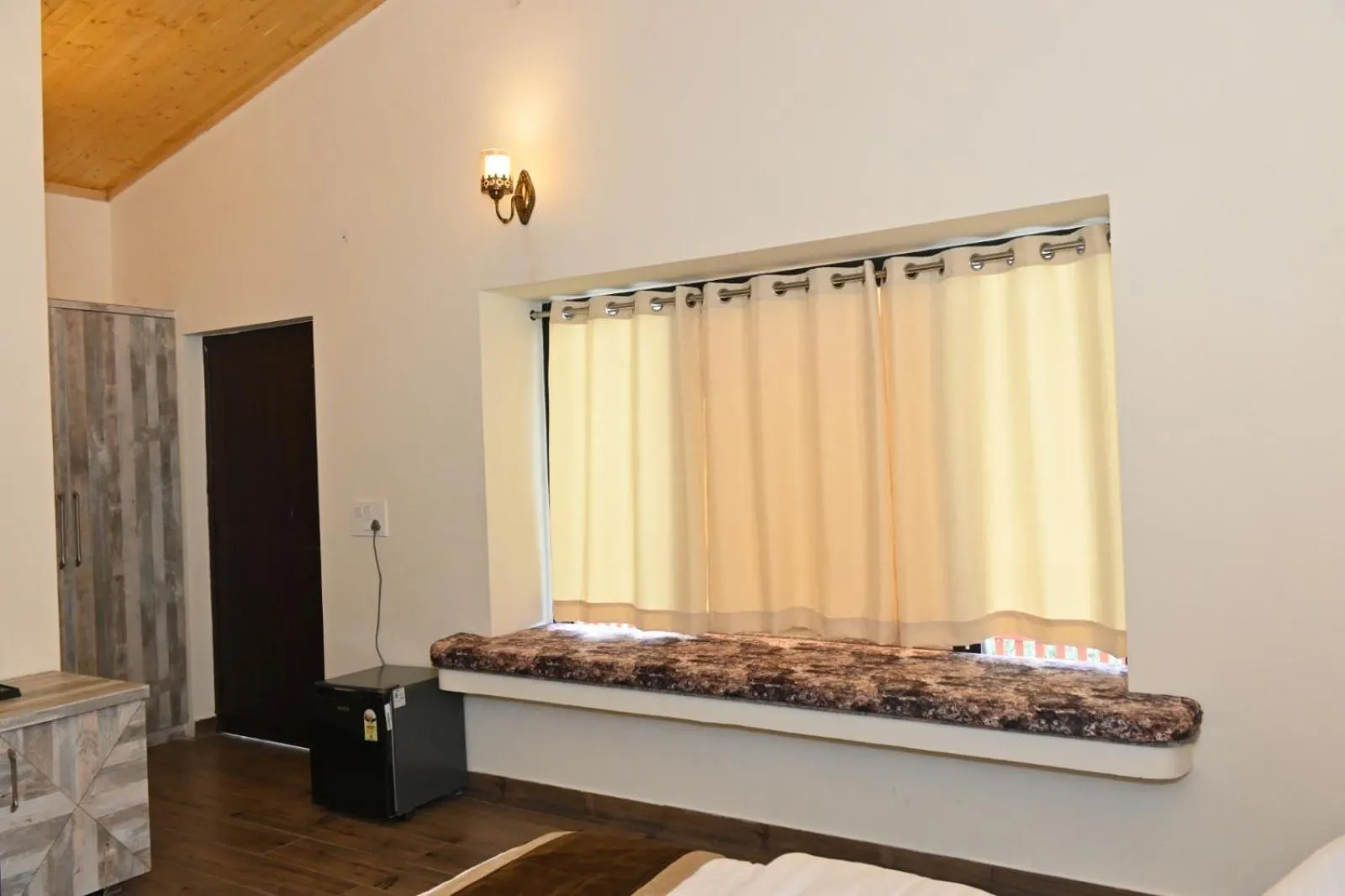 Bed in Prashanti Farms & Resort