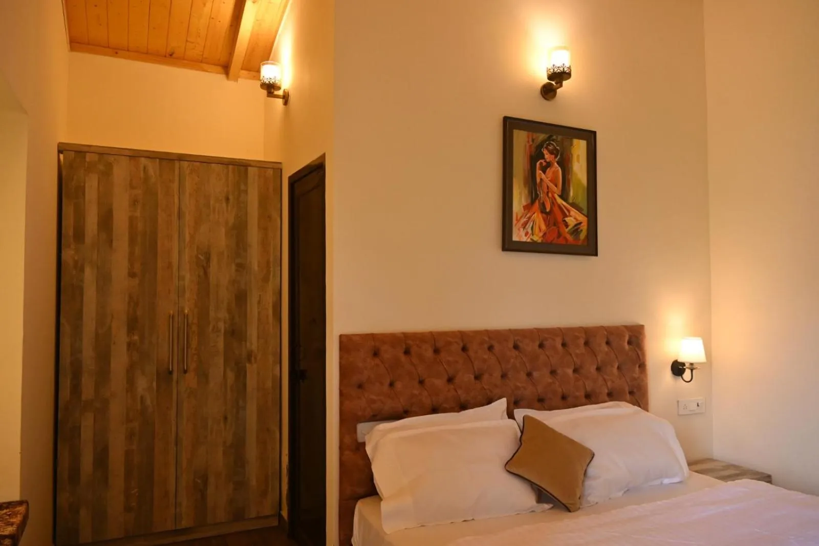 Bed in Prashanti Farms & Resort