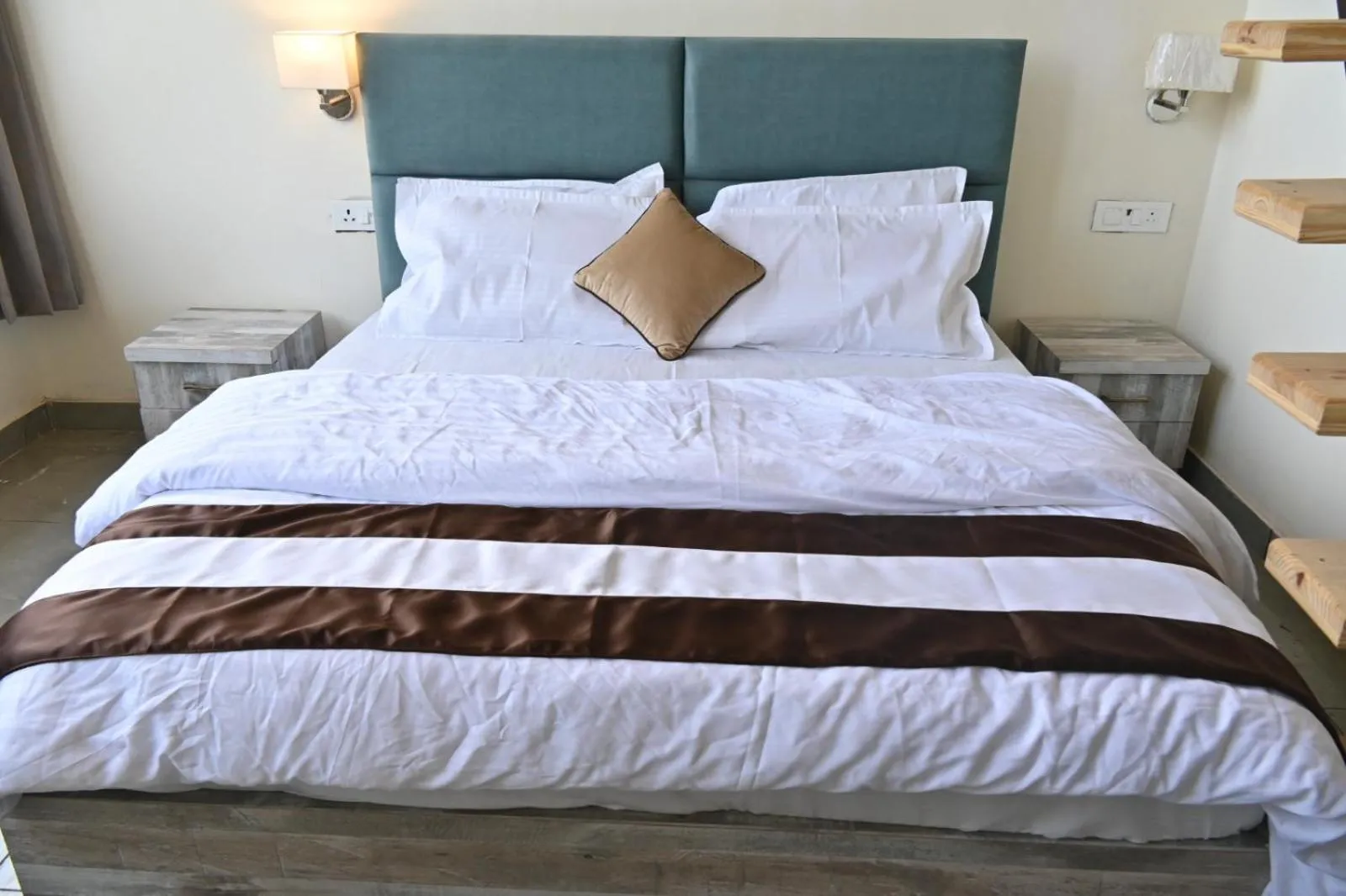 Bed in Prashanti Farms & Resort
