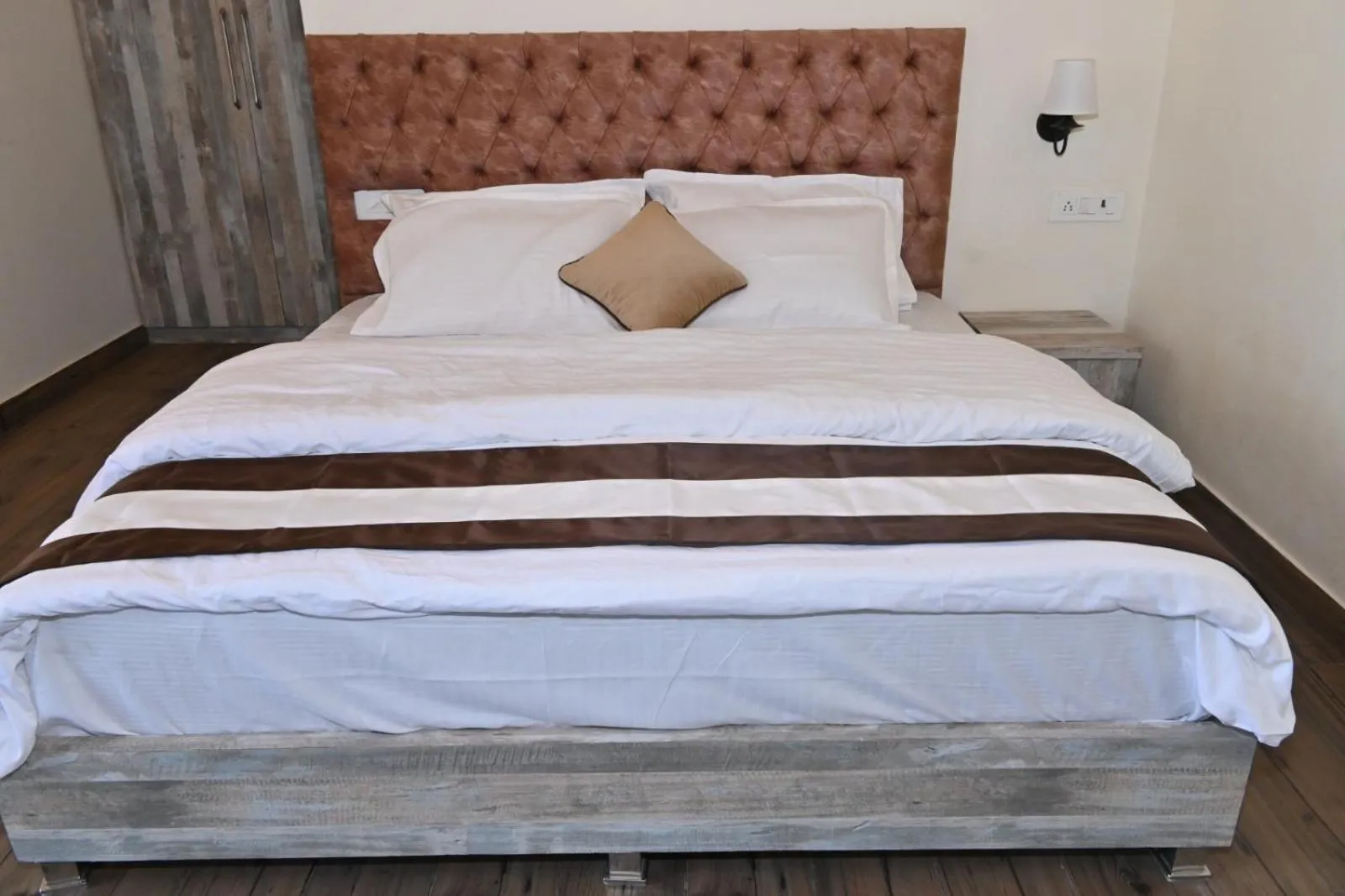Bed in Prashanti Farms & Resort