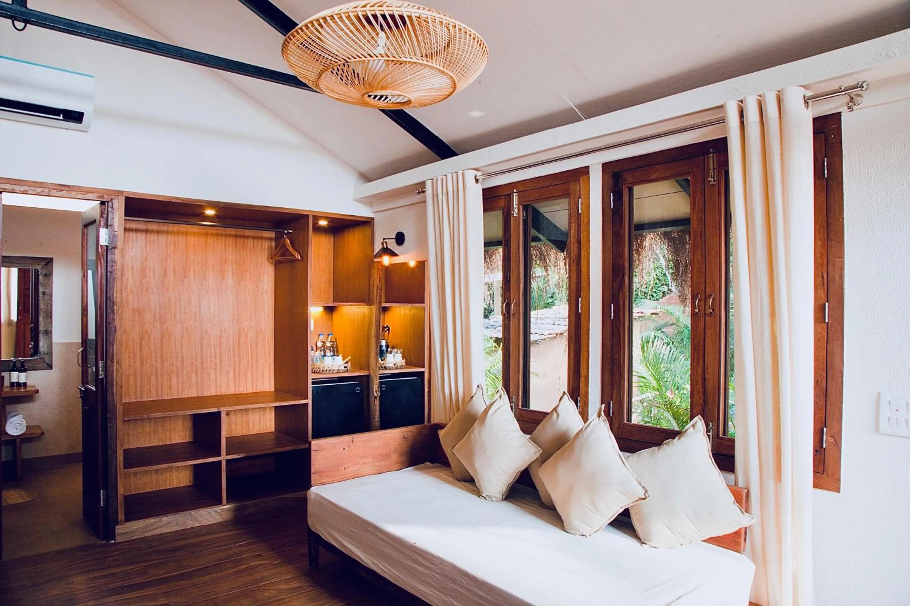 Seating area, Bed in Anahata Retreat Beach Front Ashwem Goa