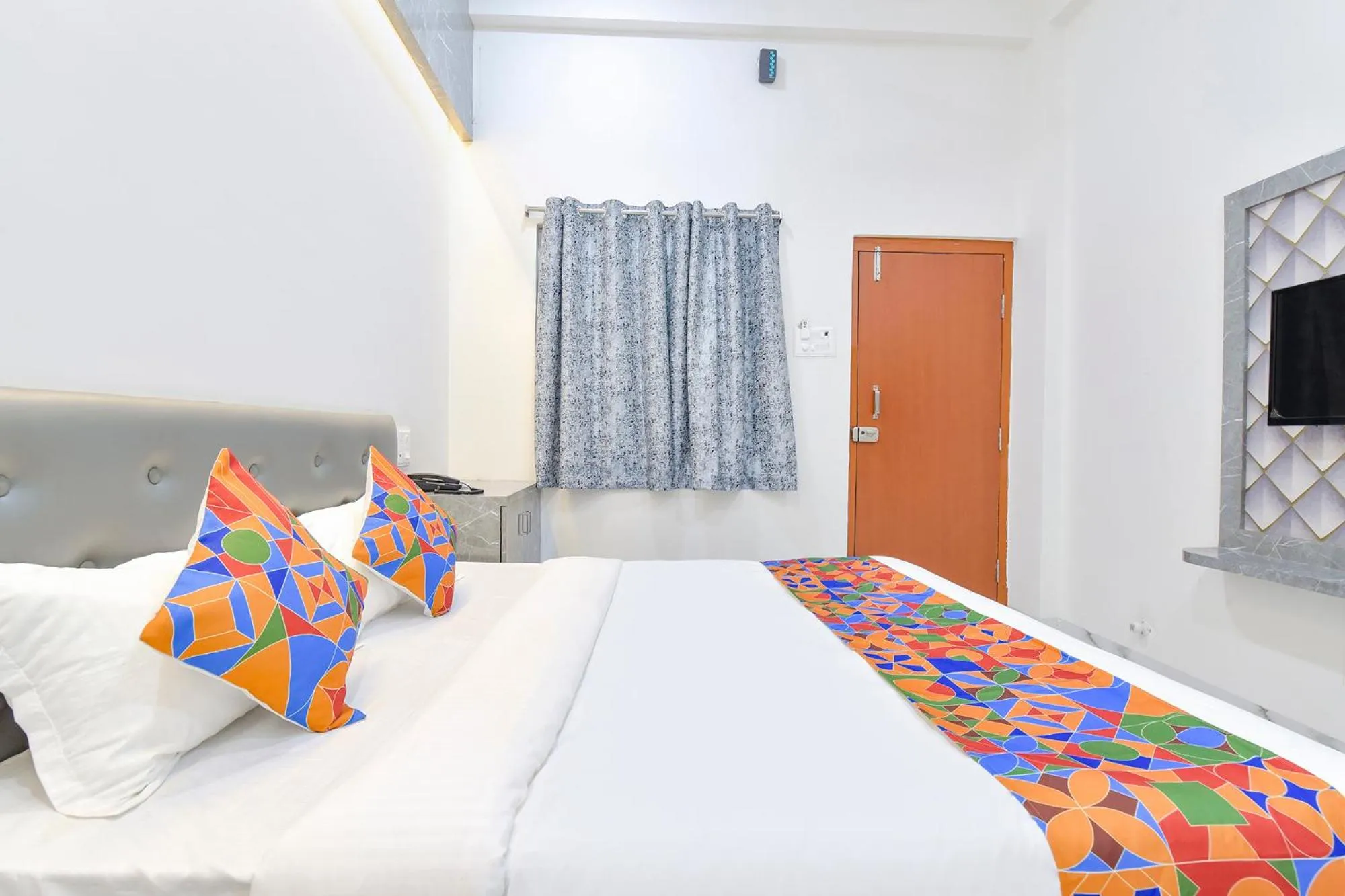 Bed in FabHotel Grand Embassy