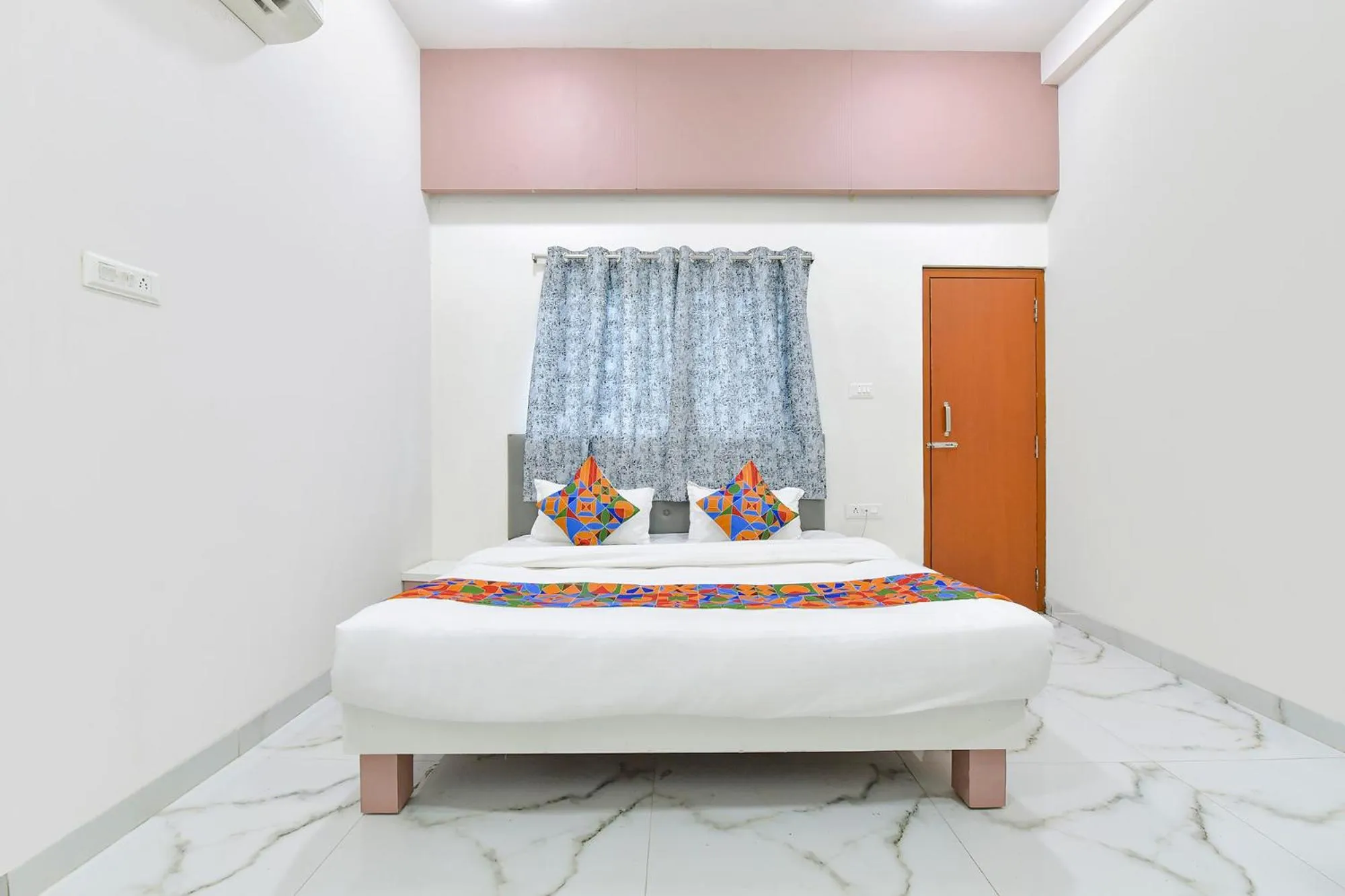 Bed in FabHotel Grand Embassy