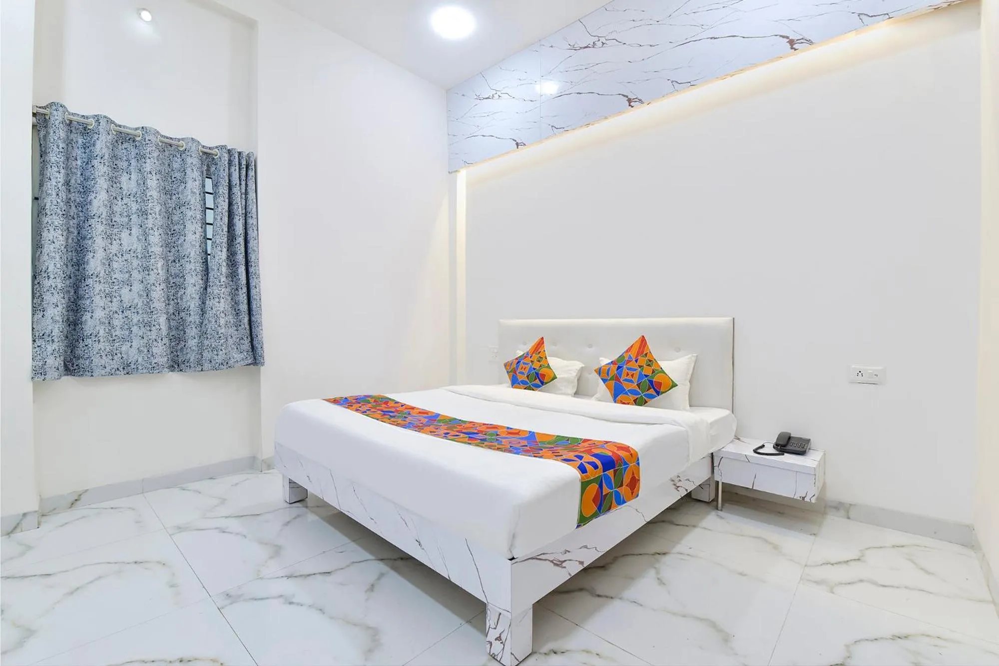 Bed in FabHotel Grand Embassy