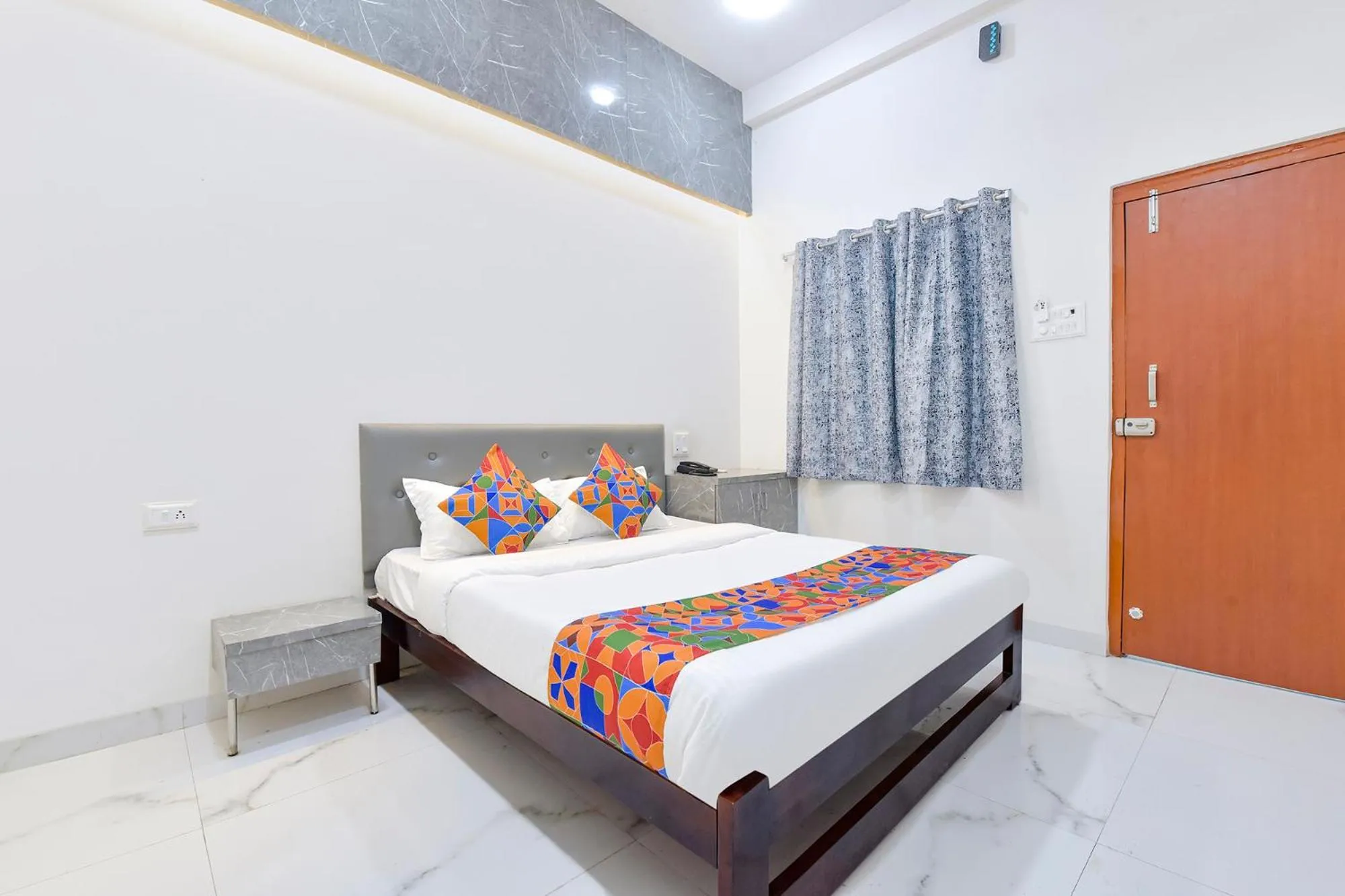 Bed in FabHotel Grand Embassy