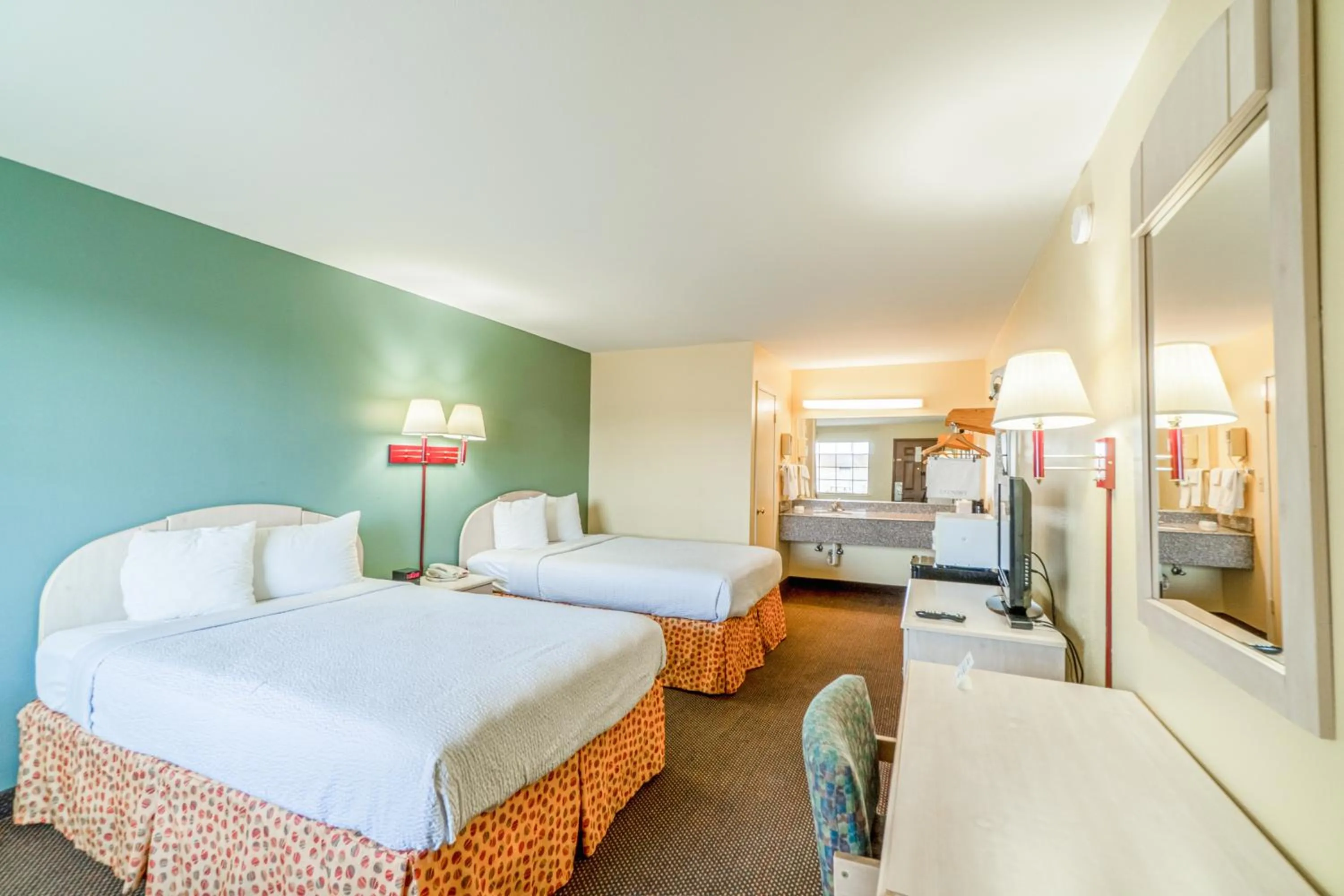 Bedroom, Bed in Shale Inn Andrews by OYO