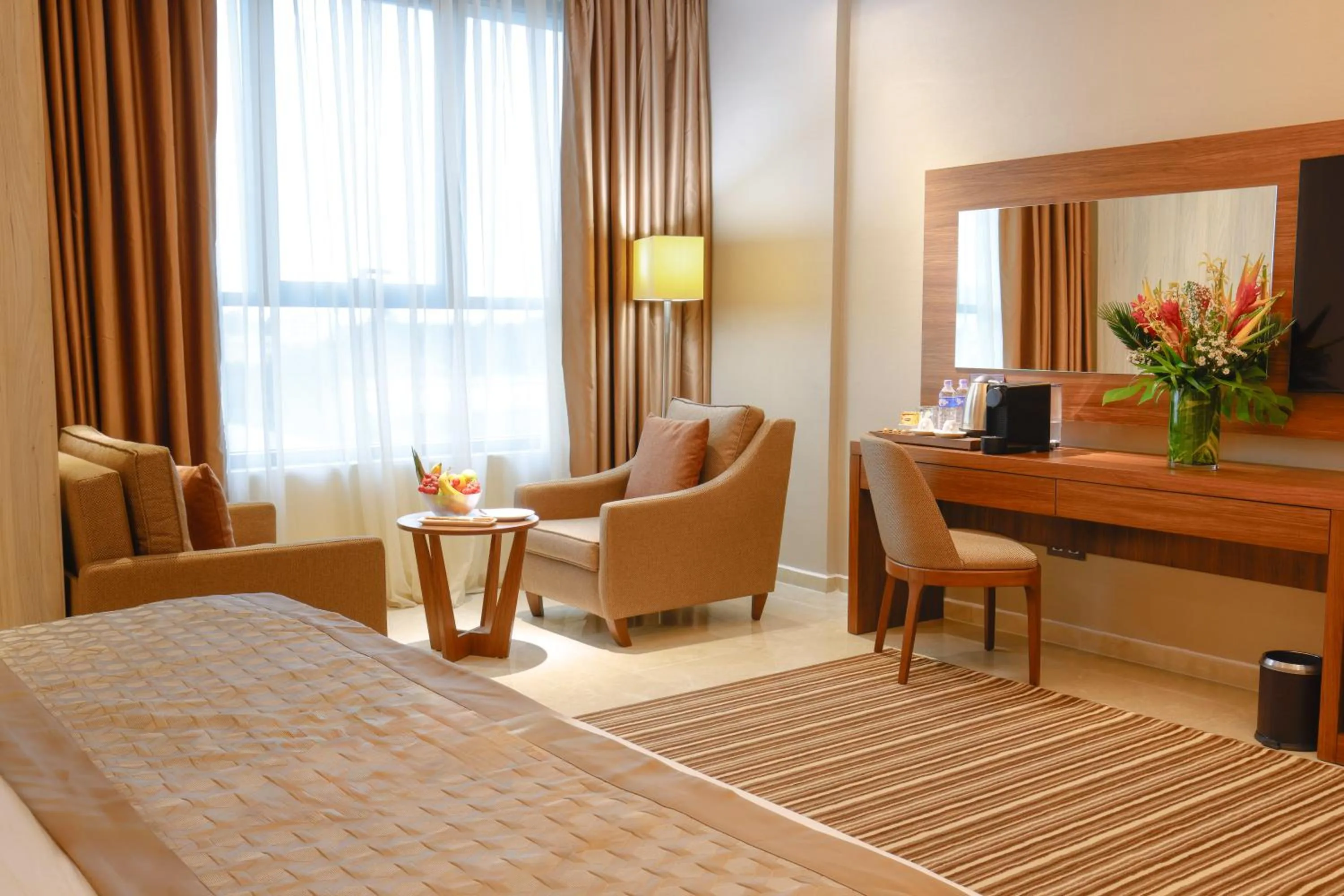 Seating area, Bed in Byblos Hotel