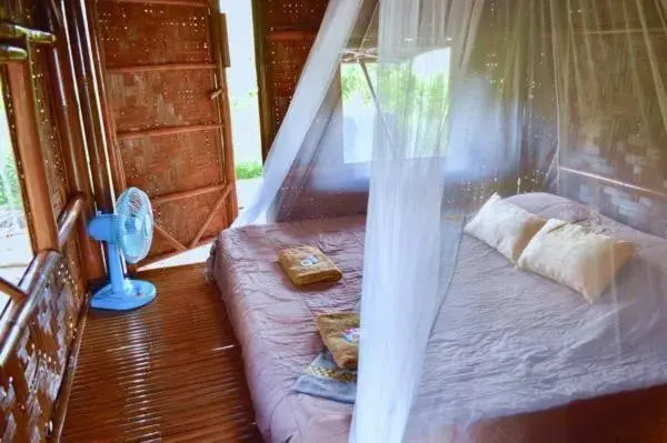 Bed in Micky Monkey Beach Hotel Phuket Maikhao Thailand Bed in Micky Monkey Beach Hotel Phuket Maikhao Thailand