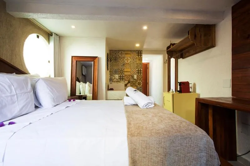 Bed in Pousada Praia João Fernandes