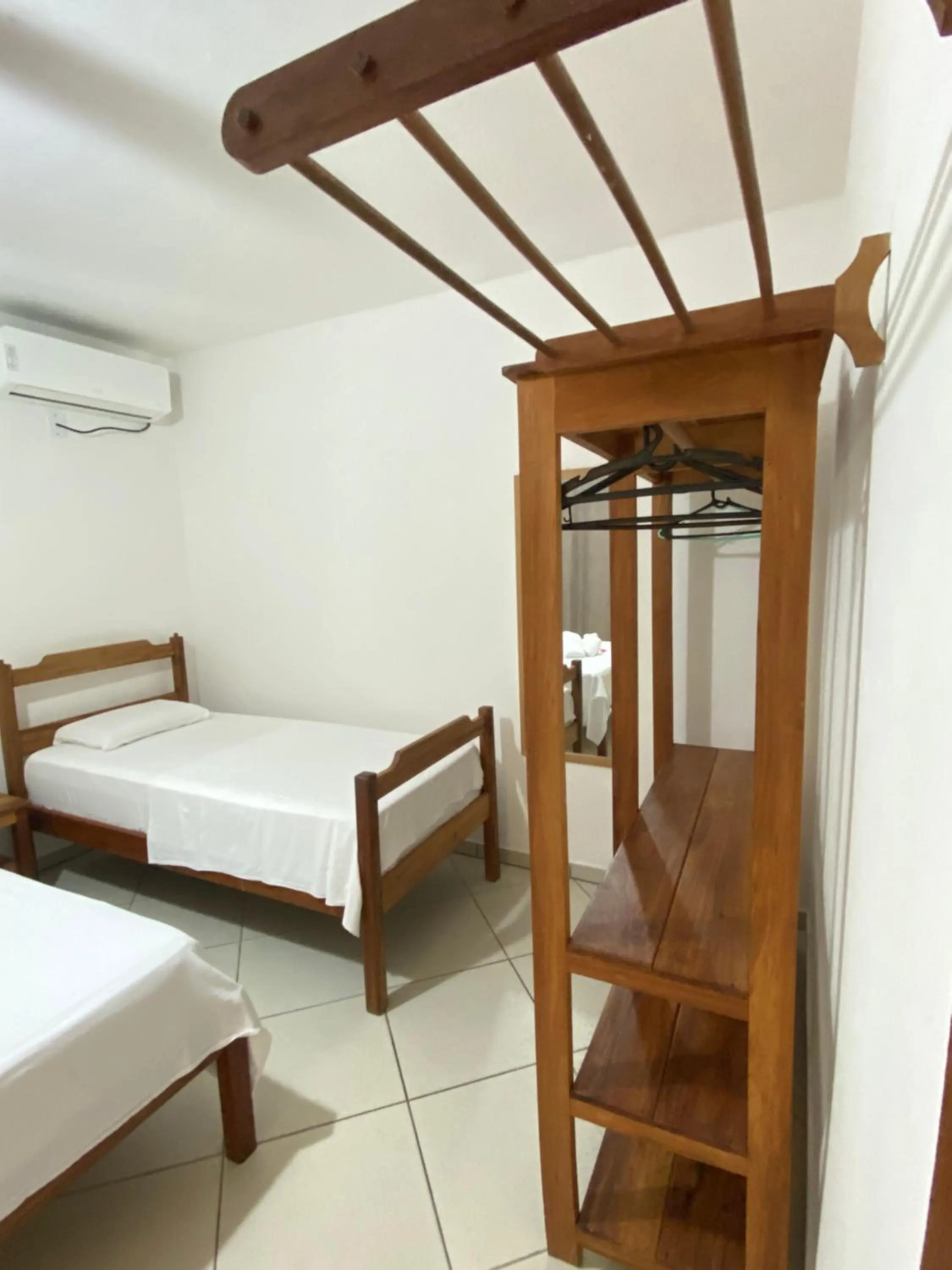 Bed in Pousada Arraial Suites
