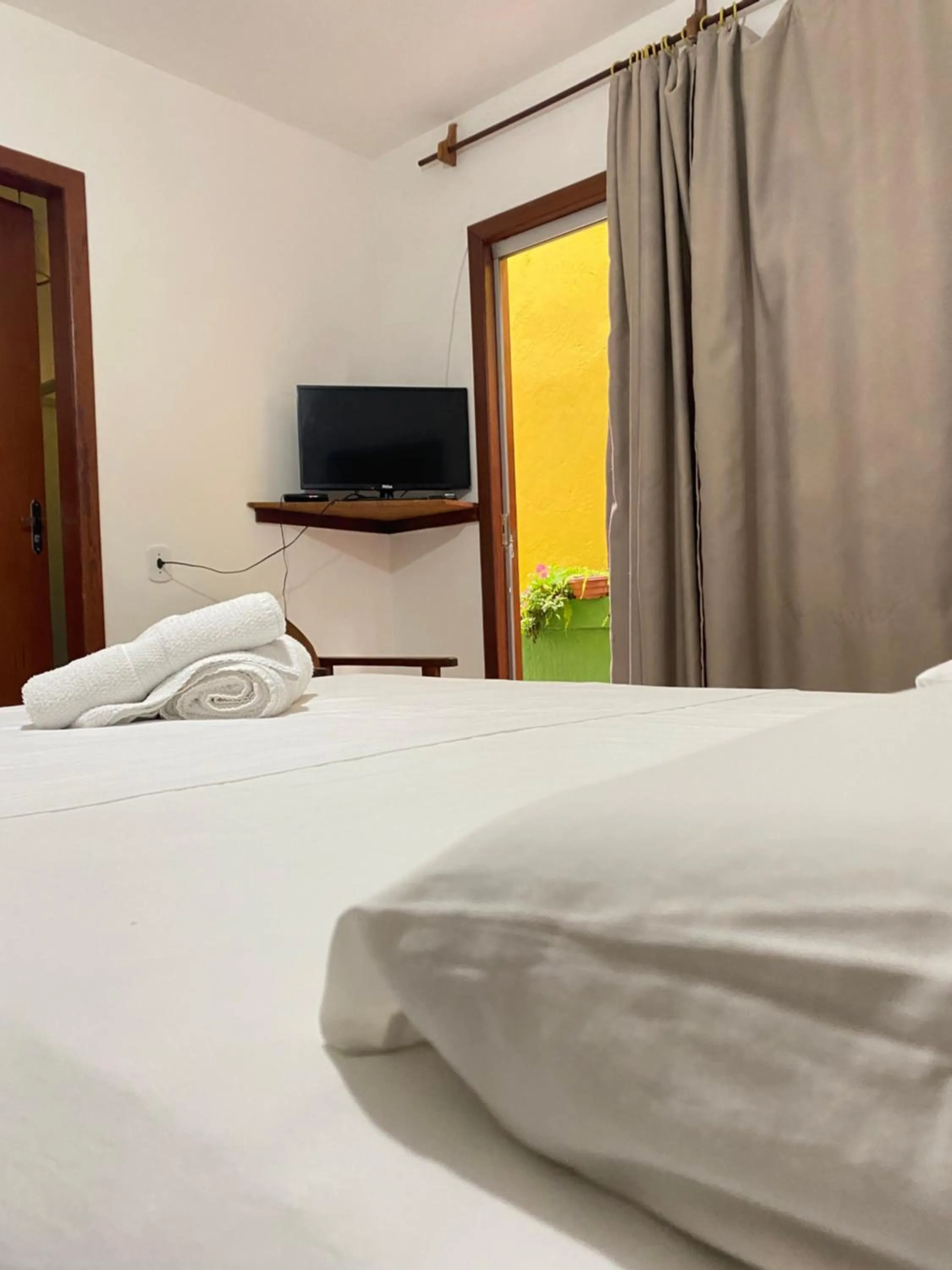 Bed in Pousada Arraial Suites