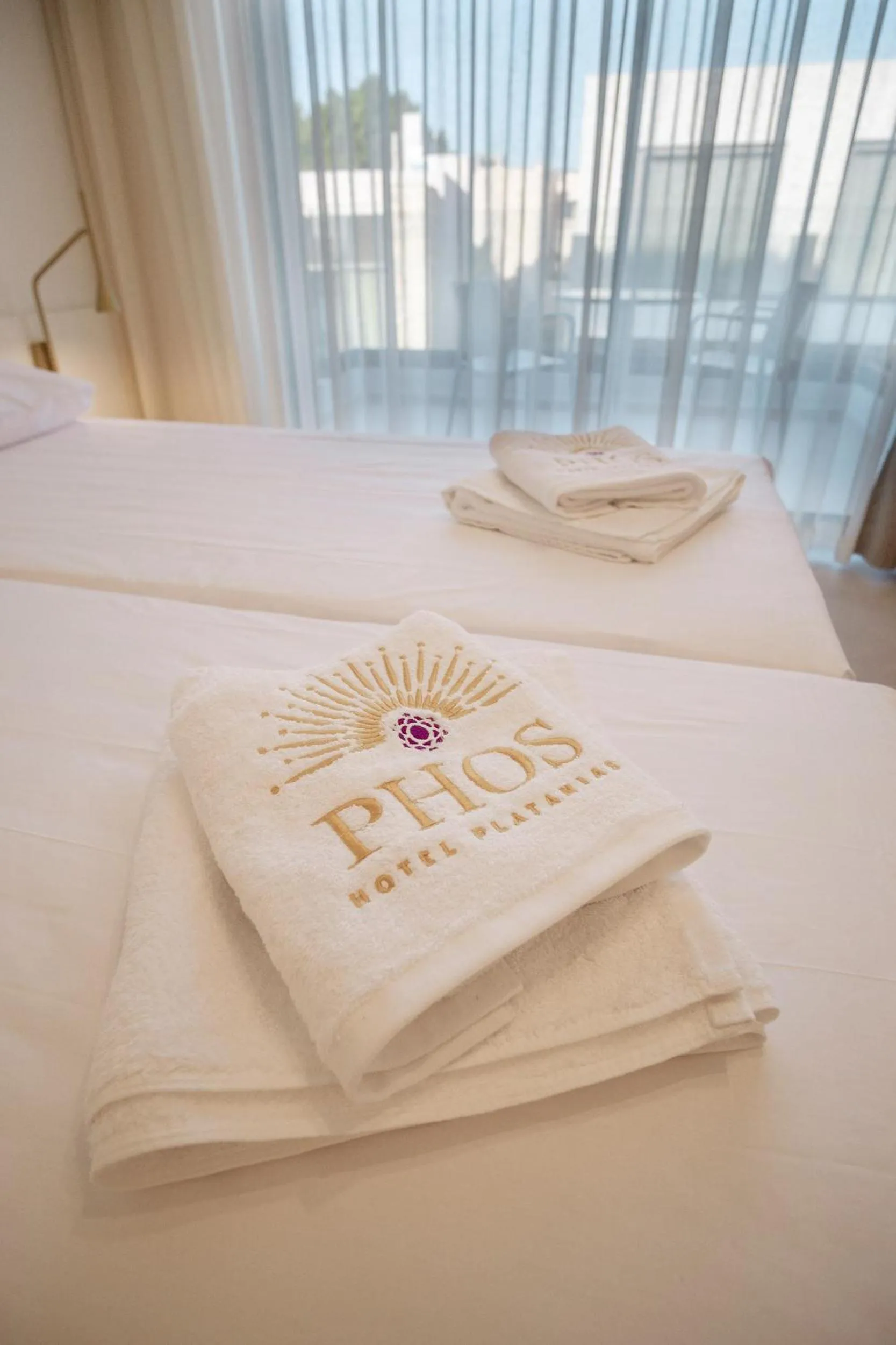 Bed in Phos Hotel Adults Only