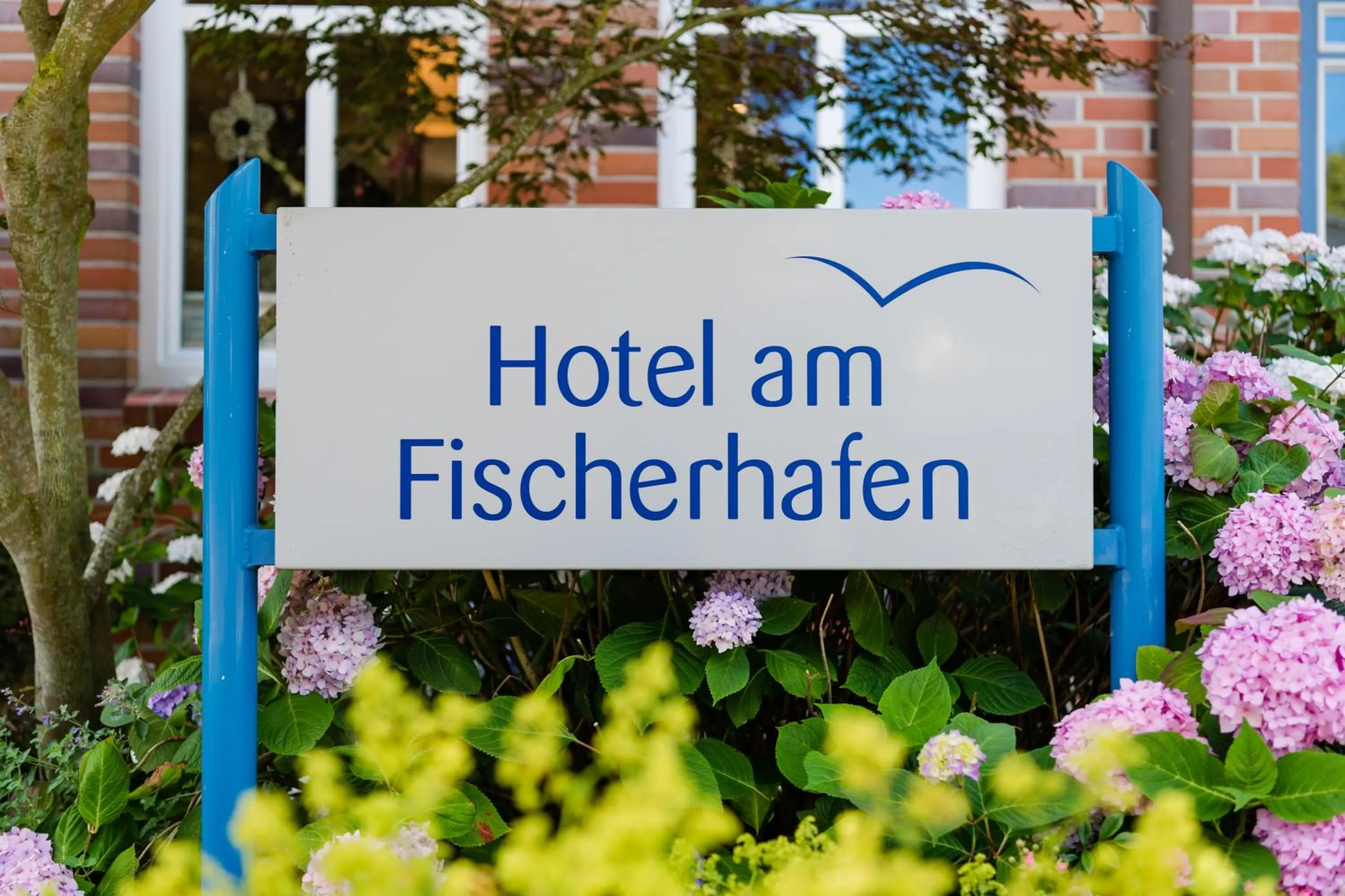 Property logo or sign in Hotel am Fischerhafen