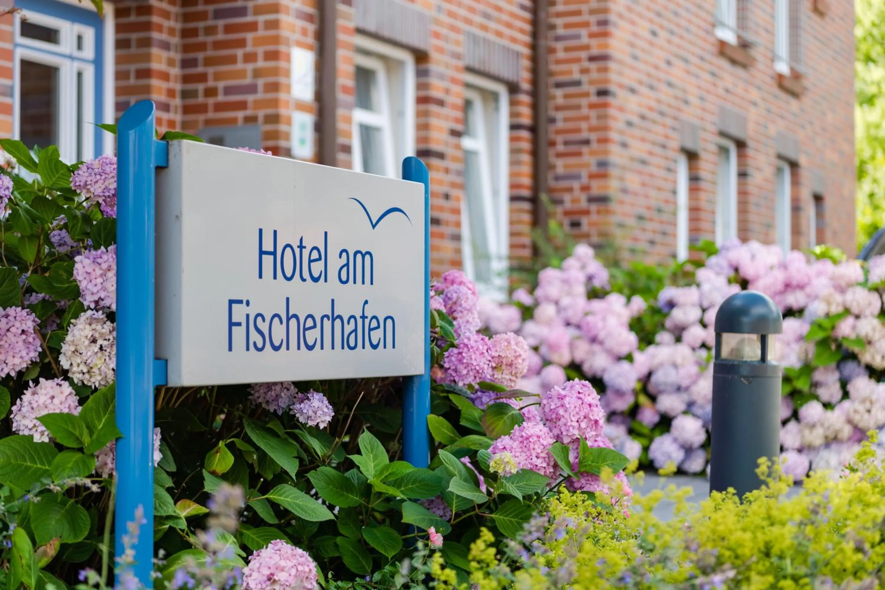 Property logo or sign in Hotel am Fischerhafen