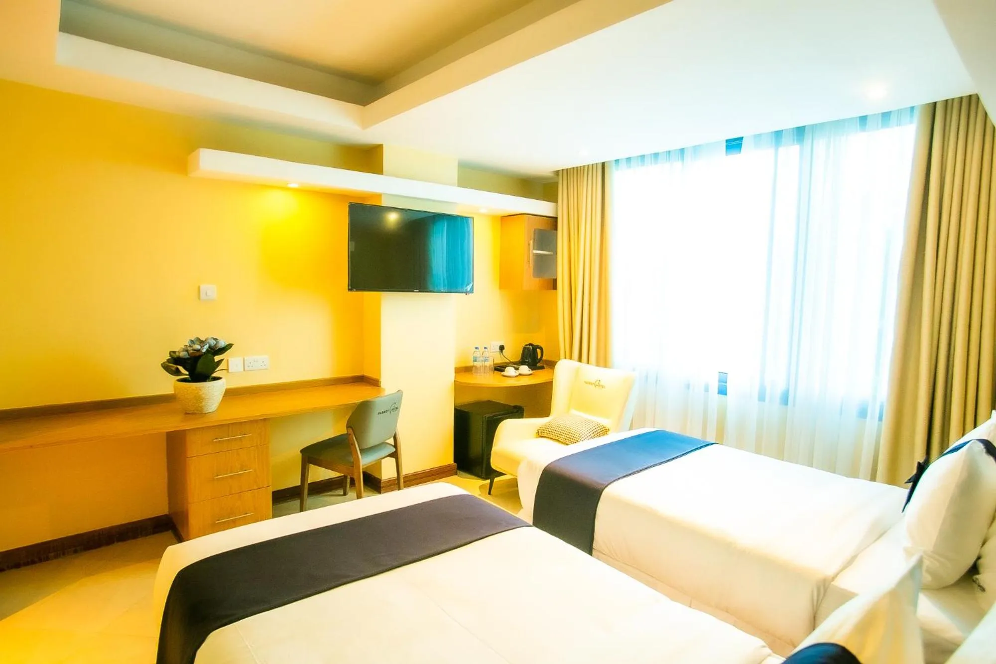 Bed in Parrot Hotel Arusha