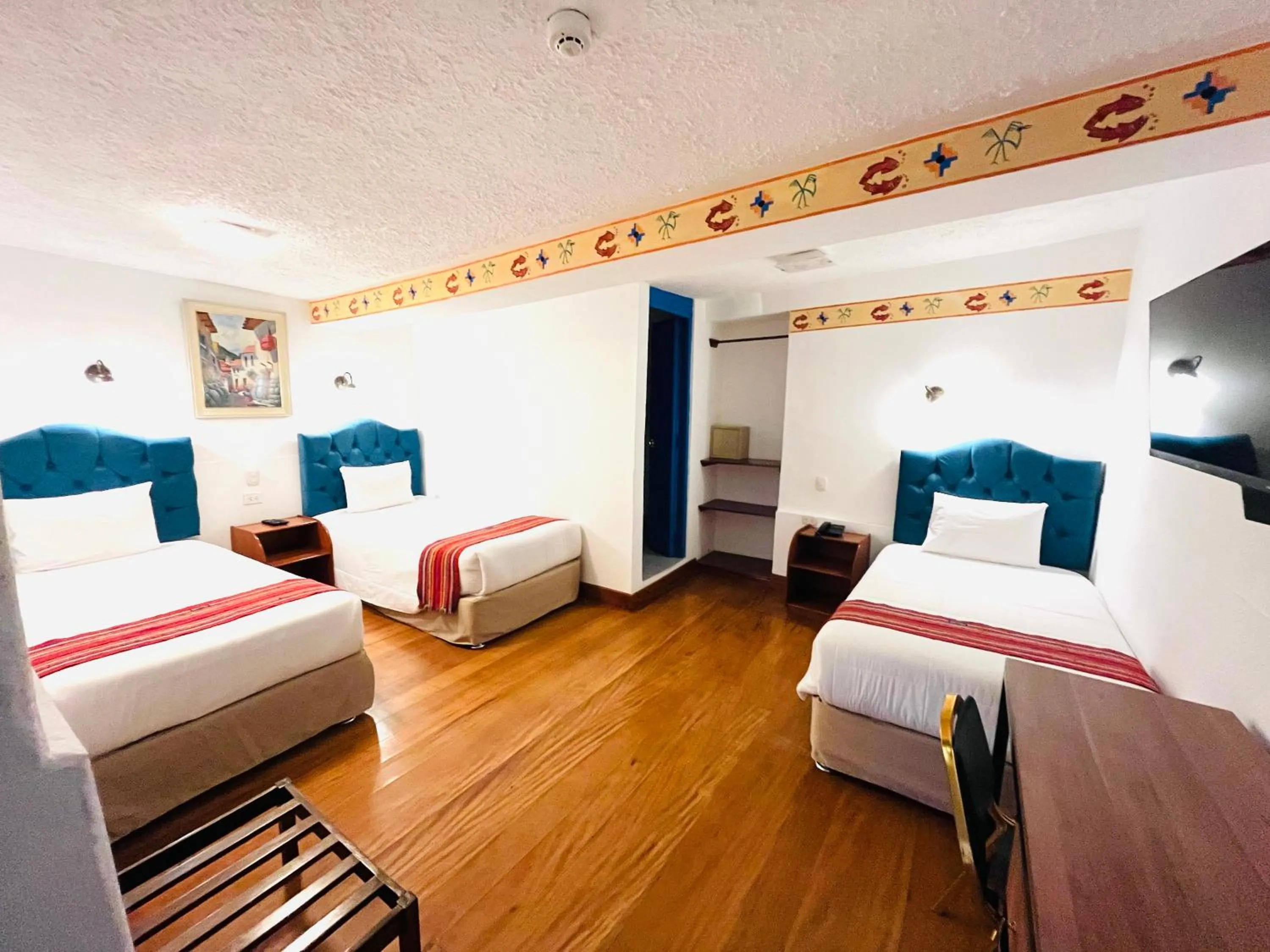 Photo of the whole room, Bed in Rojas Plaza Boutique