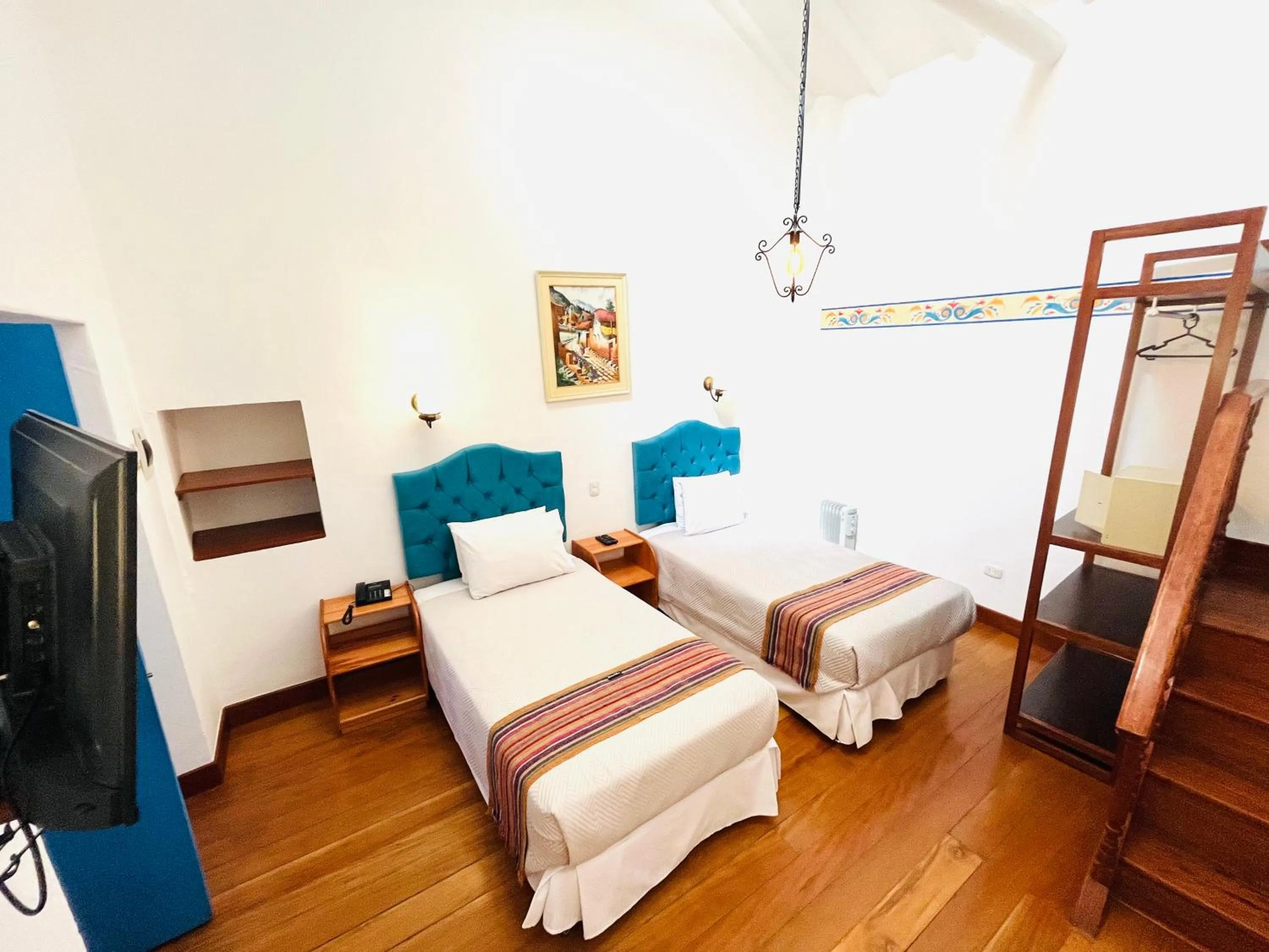 Photo of the whole room, Bed in Rojas Plaza Boutique