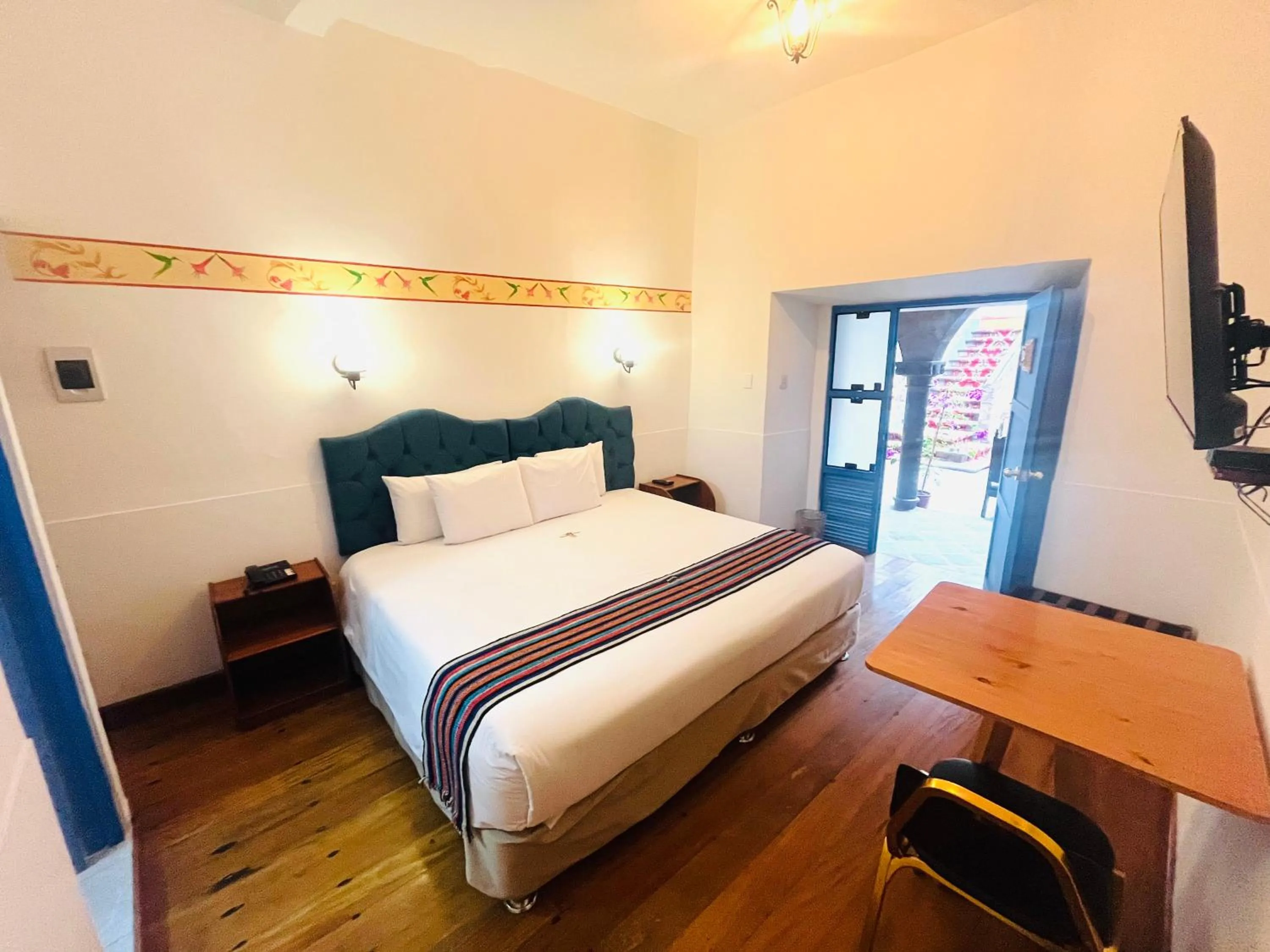 Photo of the whole room, Bed in Rojas Plaza Boutique