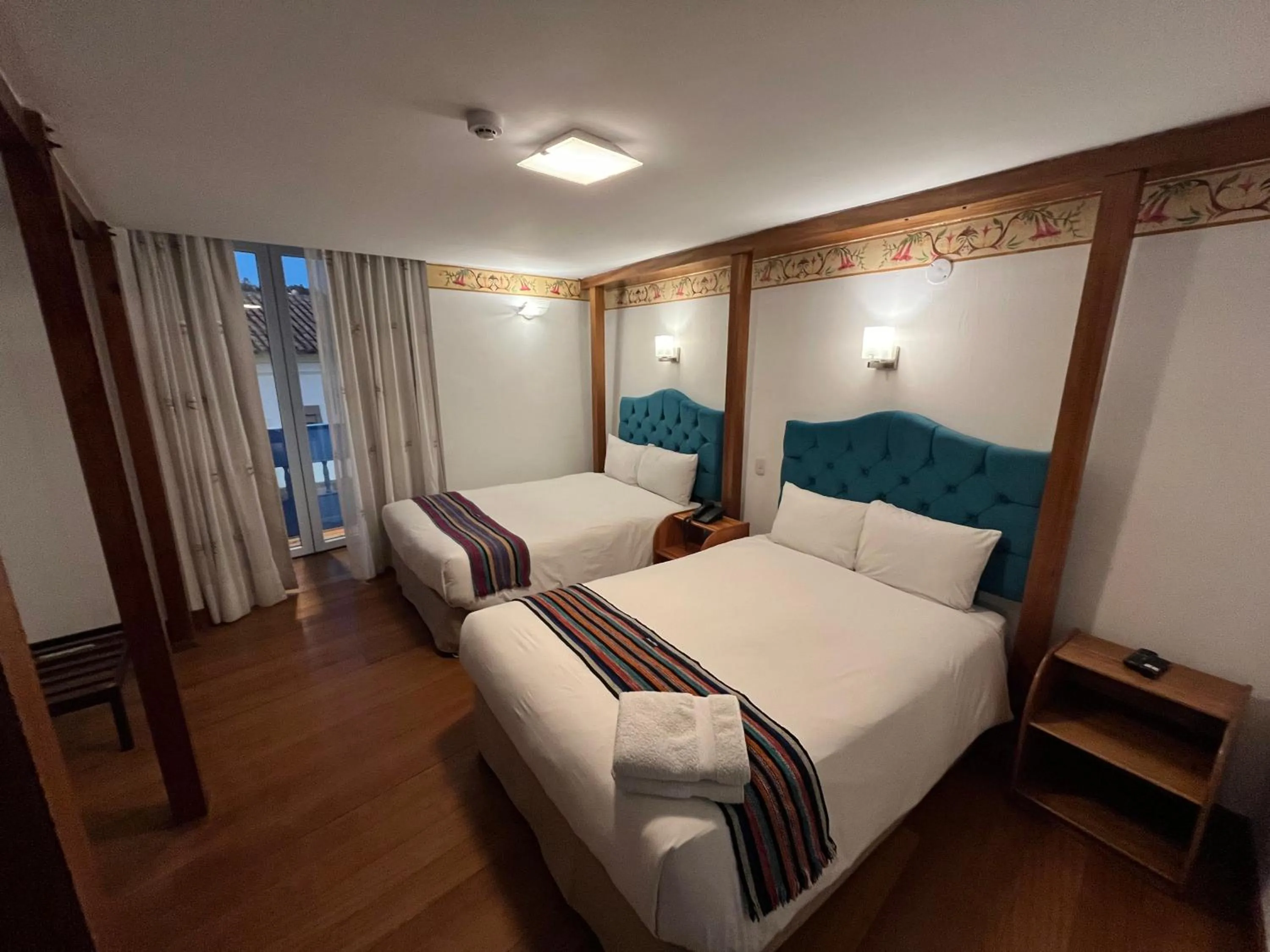 Photo of the whole room, Bed in Rojas Plaza Boutique