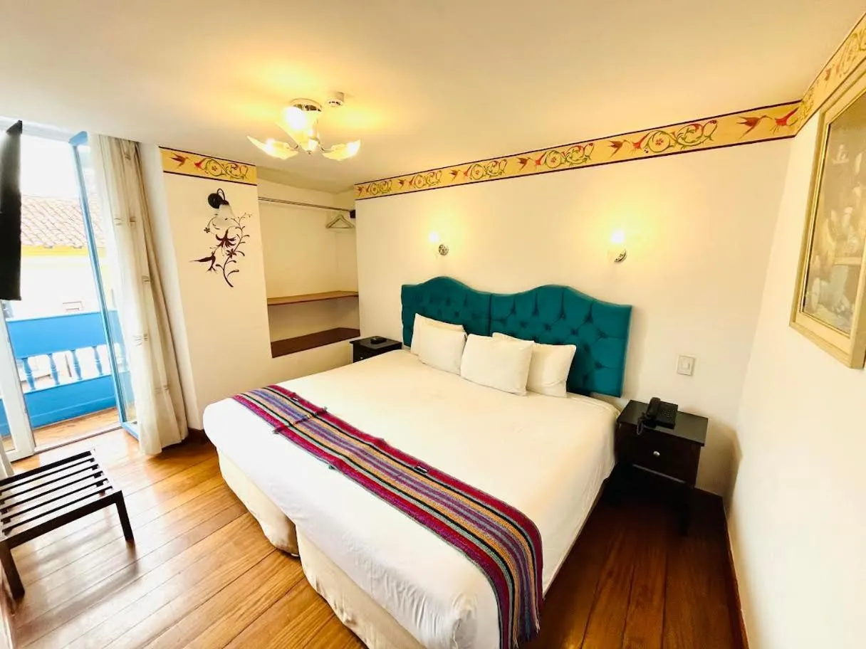 Photo of the whole room, Bed in Rojas Plaza Boutique