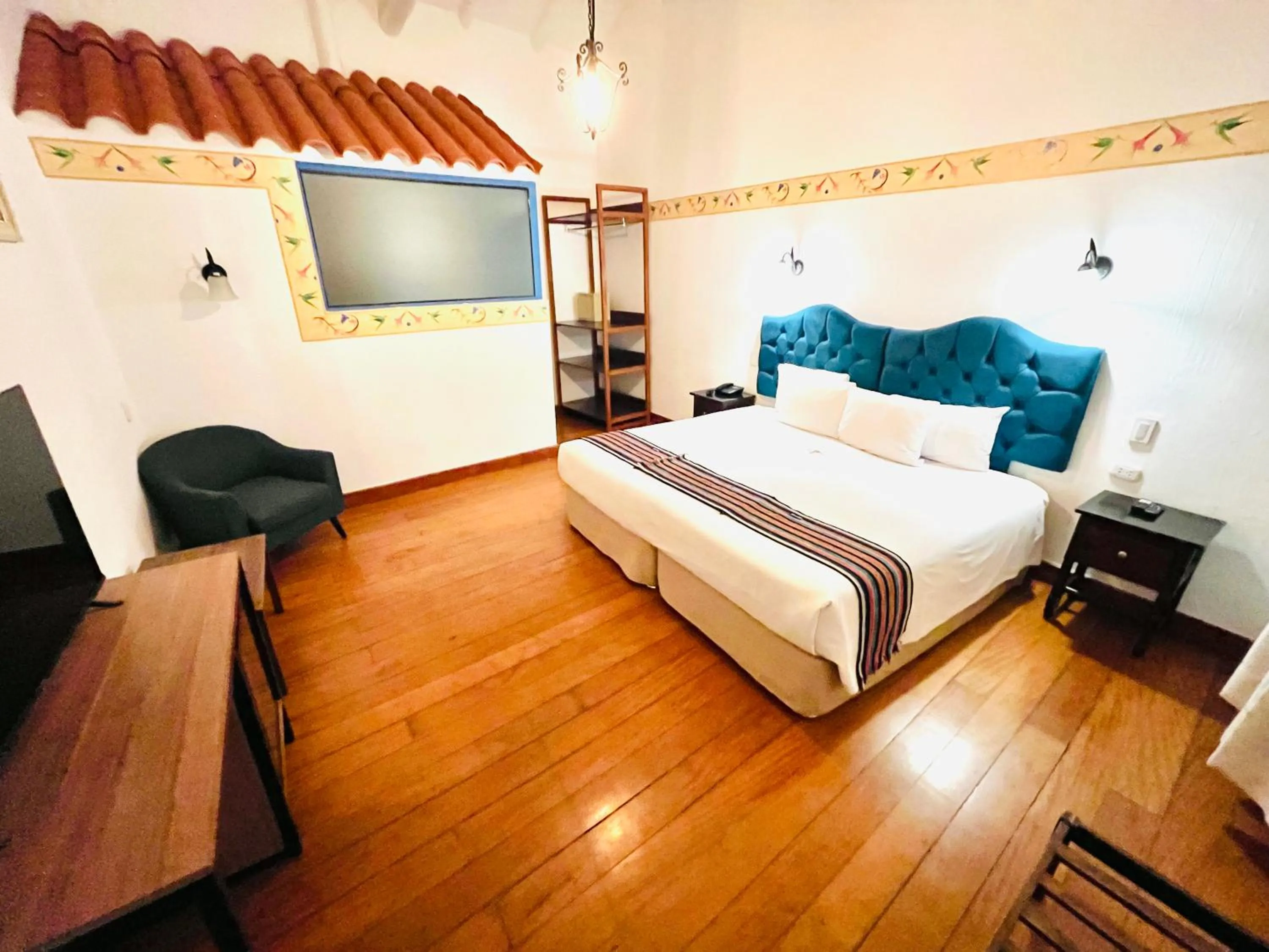 Photo of the whole room, Bed in Rojas Plaza Boutique