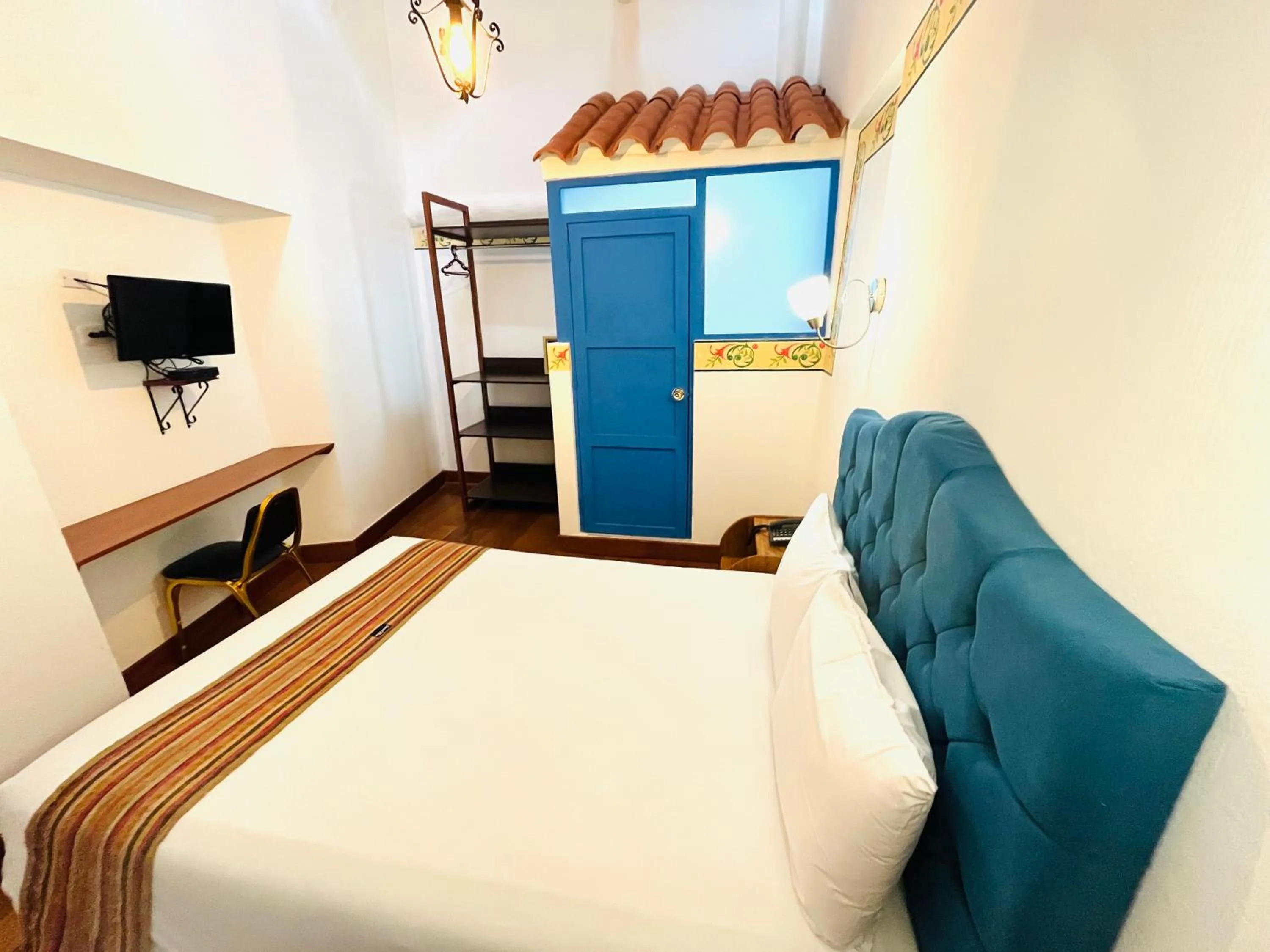 Photo of the whole room, Bed in Rojas Plaza Boutique