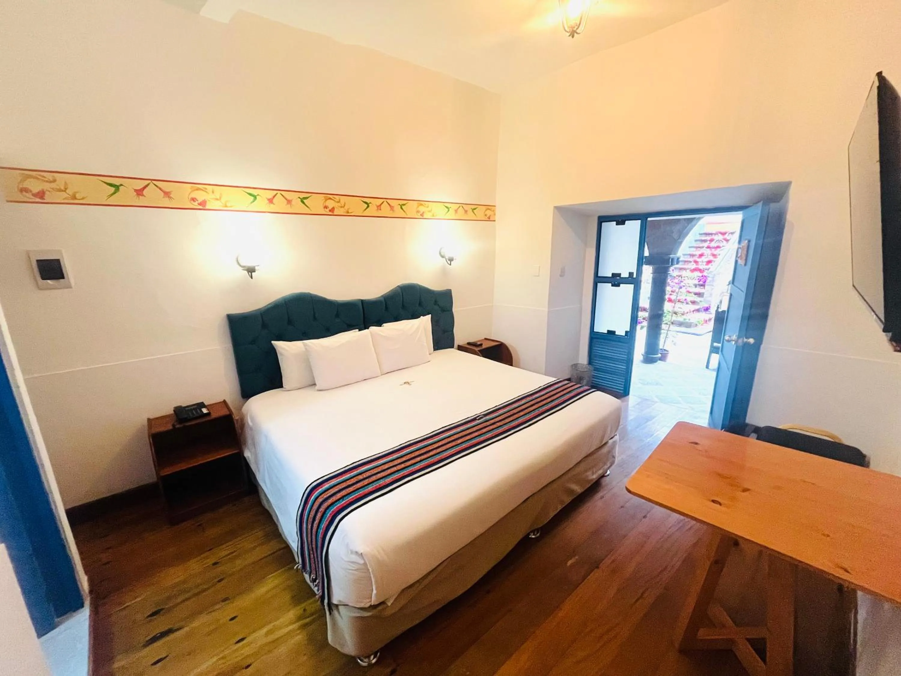 Photo of the whole room, Bed in Rojas Plaza Boutique