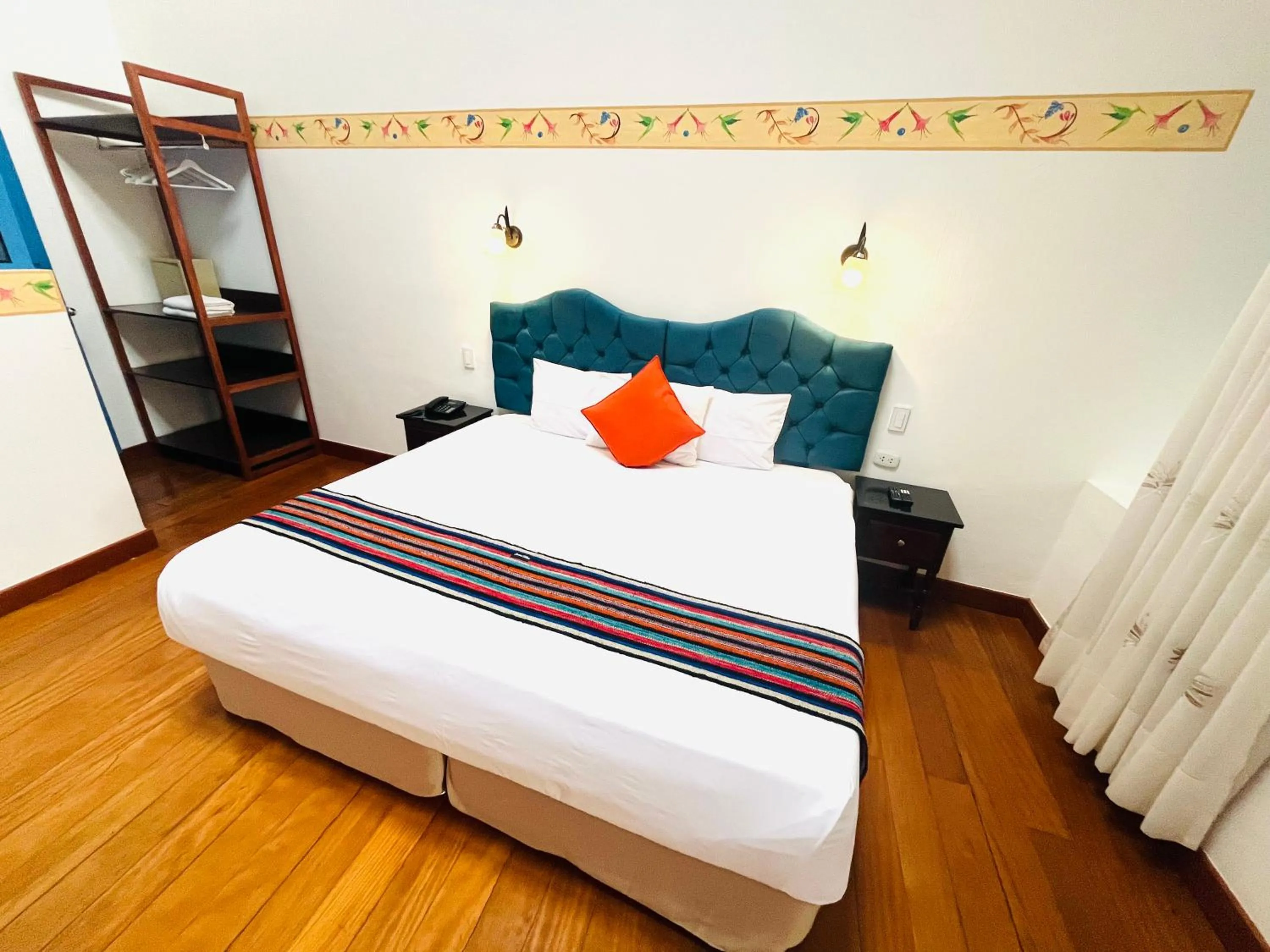 Photo of the whole room, Bed in Rojas Plaza Boutique